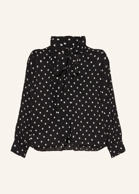 Schwarze Langarmbluse mit weißen Punkten und elegantem Schluppenkragen.