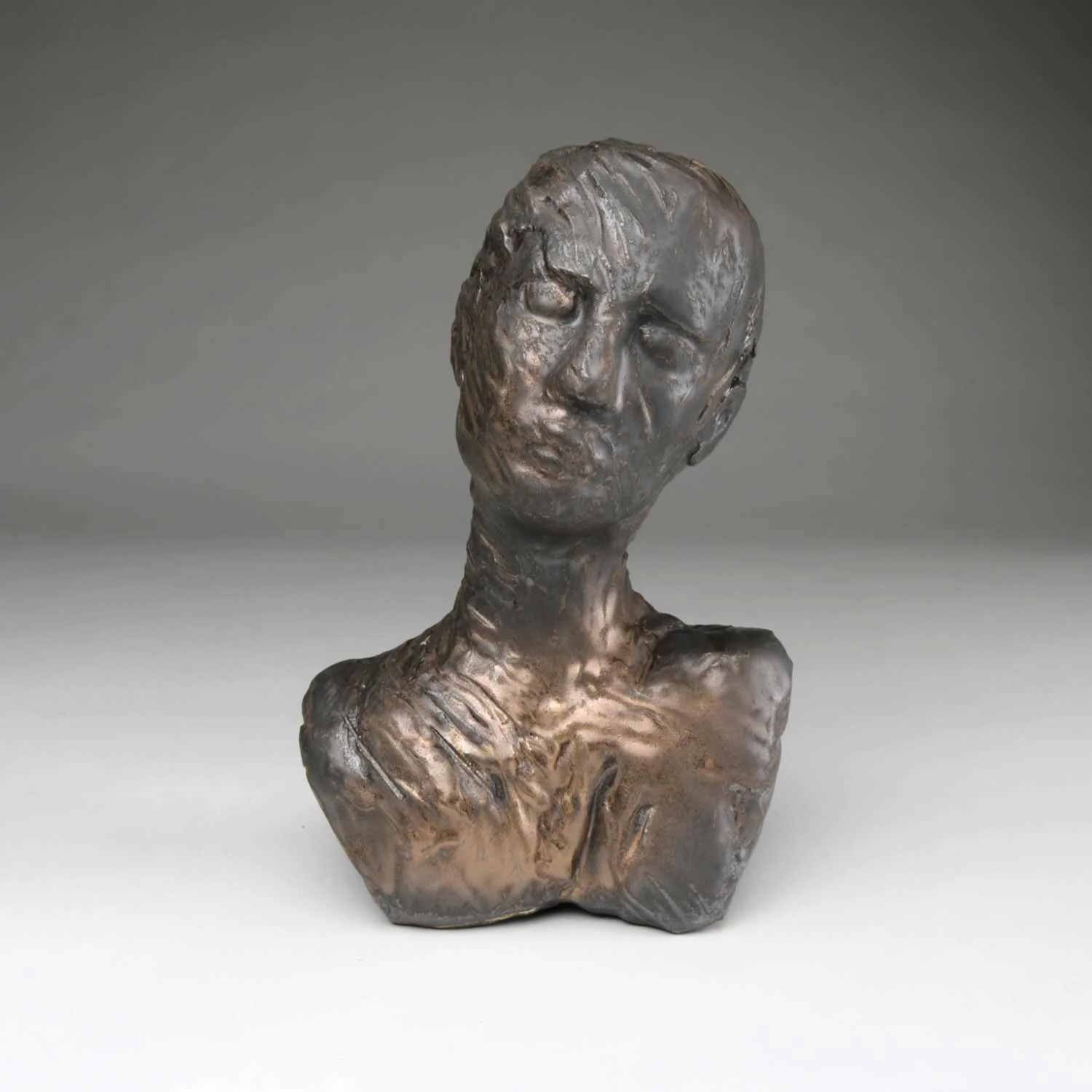 Attune, a large  bust by Lisa Hilton featuring bronze glaze and a receptive posture from the Women in Conversation collection.