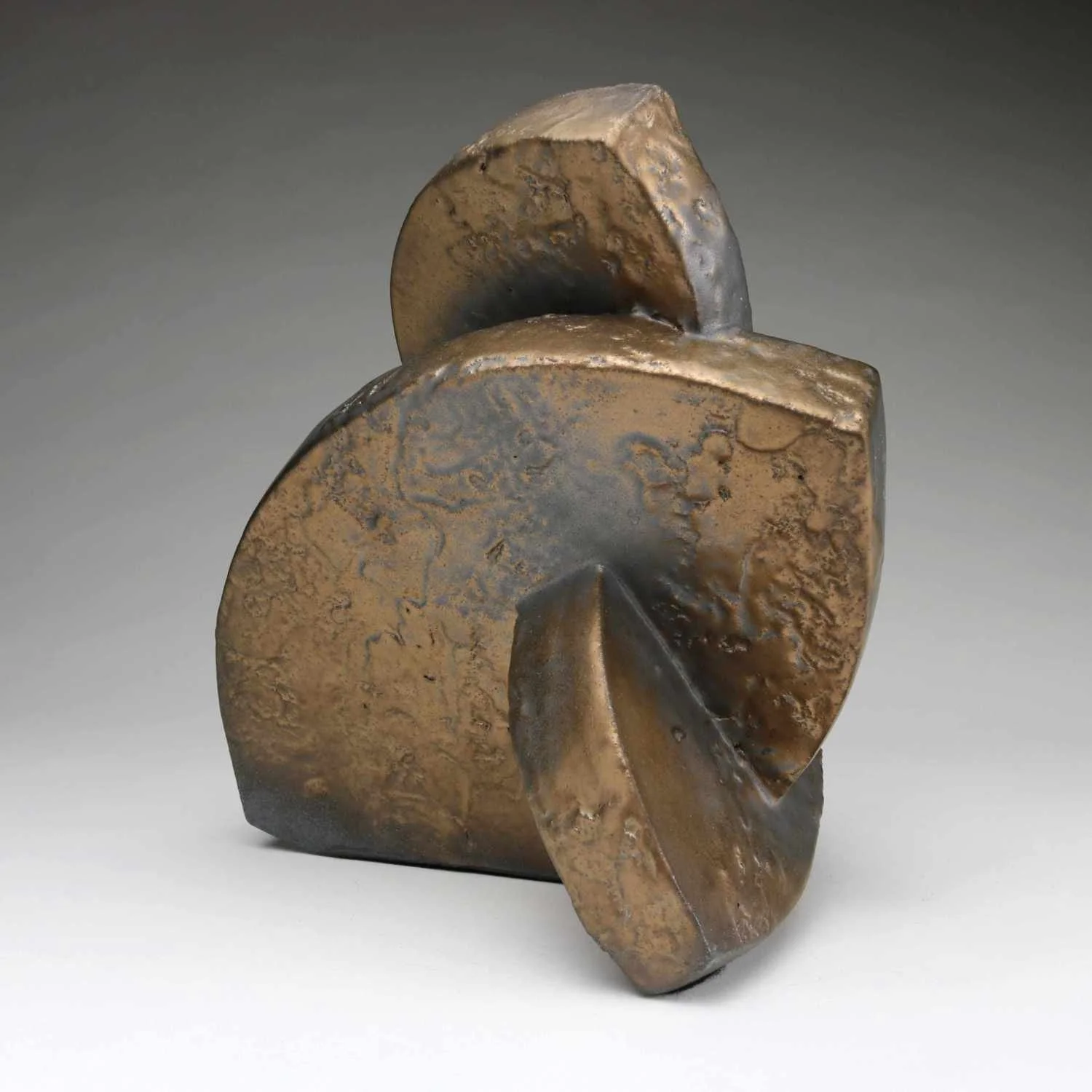 Abstract Ceramic Sculpture of three curved forms with bronze glaze