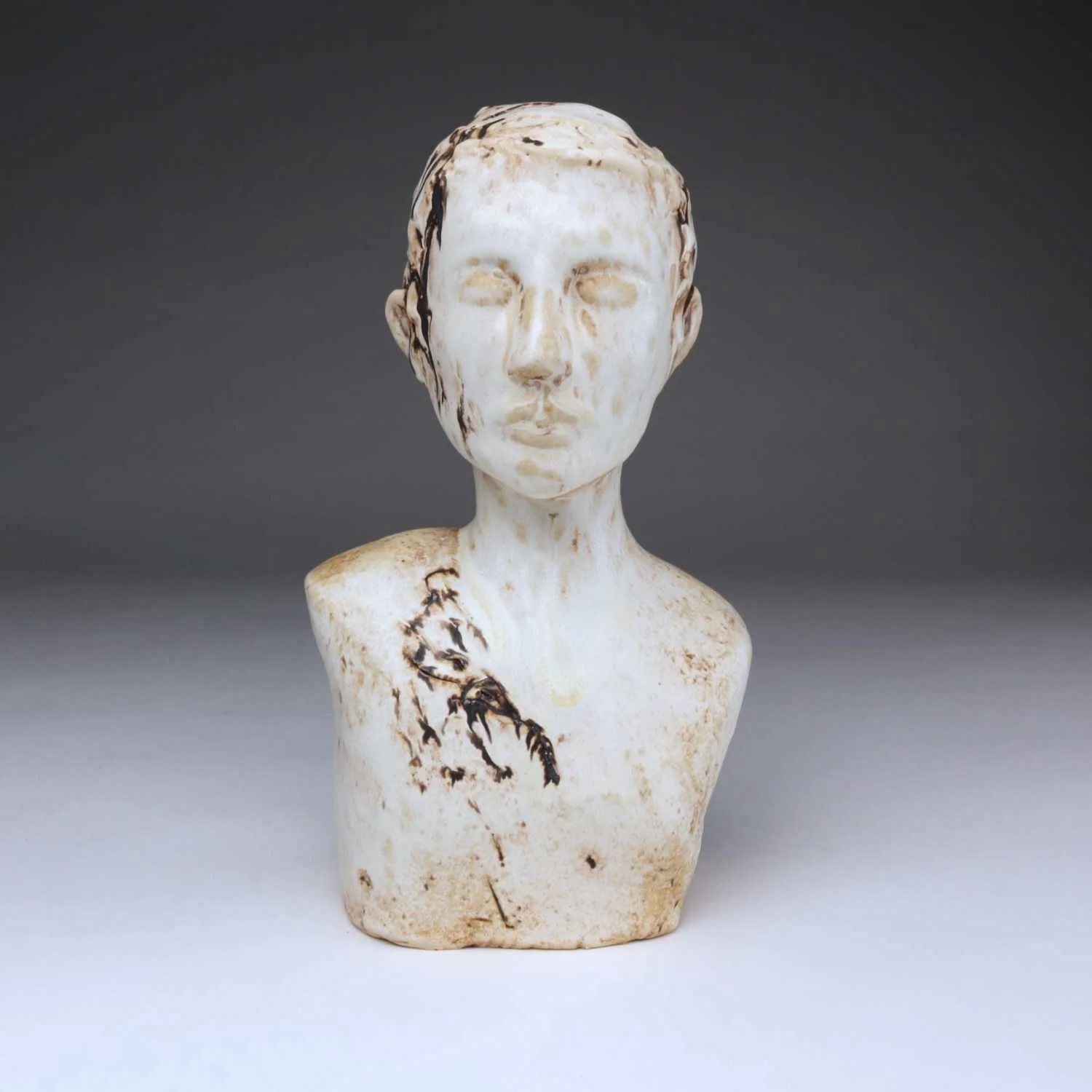 Resilient, a large ceramic bust by Lisa Hilton with textured surface and bronze accents exploring endurance from the Women in Conversation collection.