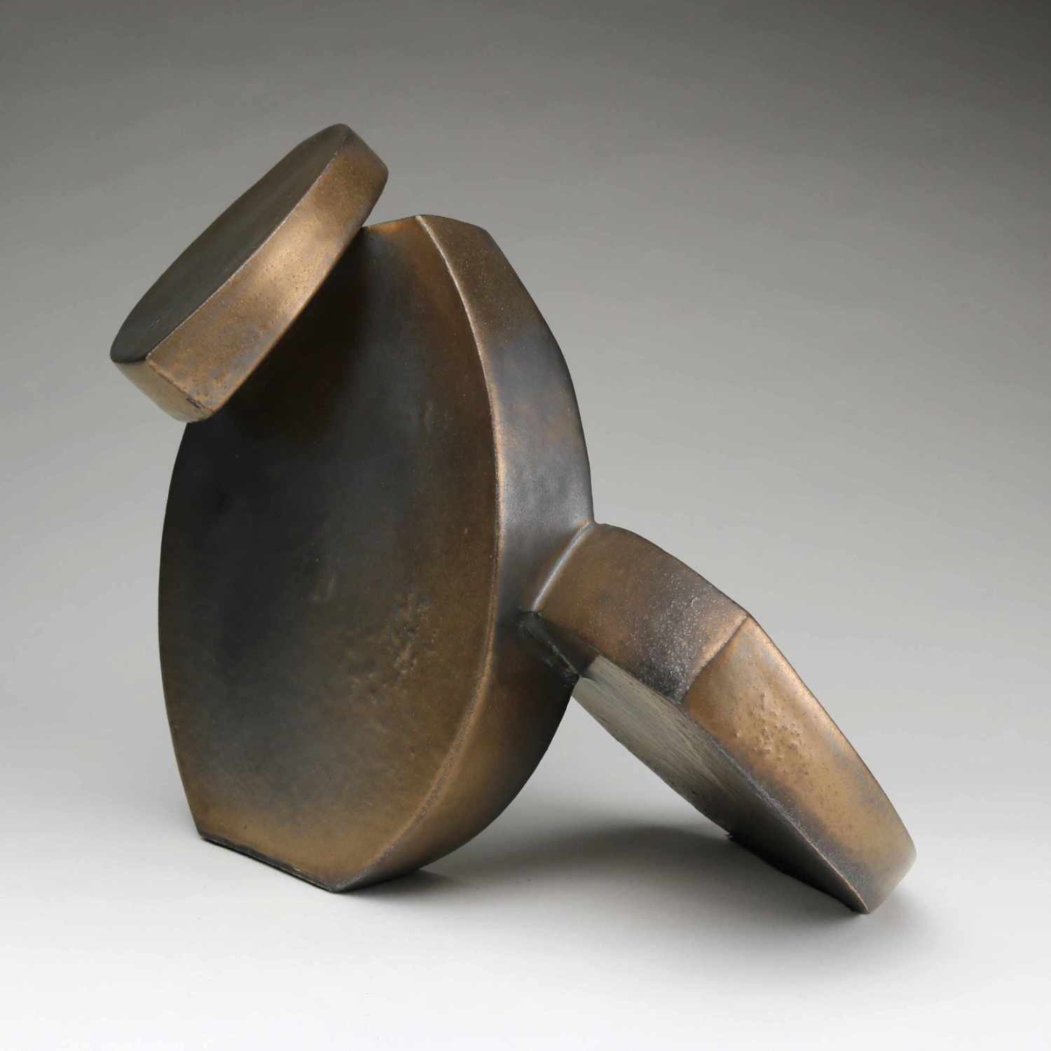 Abstract Ceramic Sculpture of three curved forms with bronze glaze