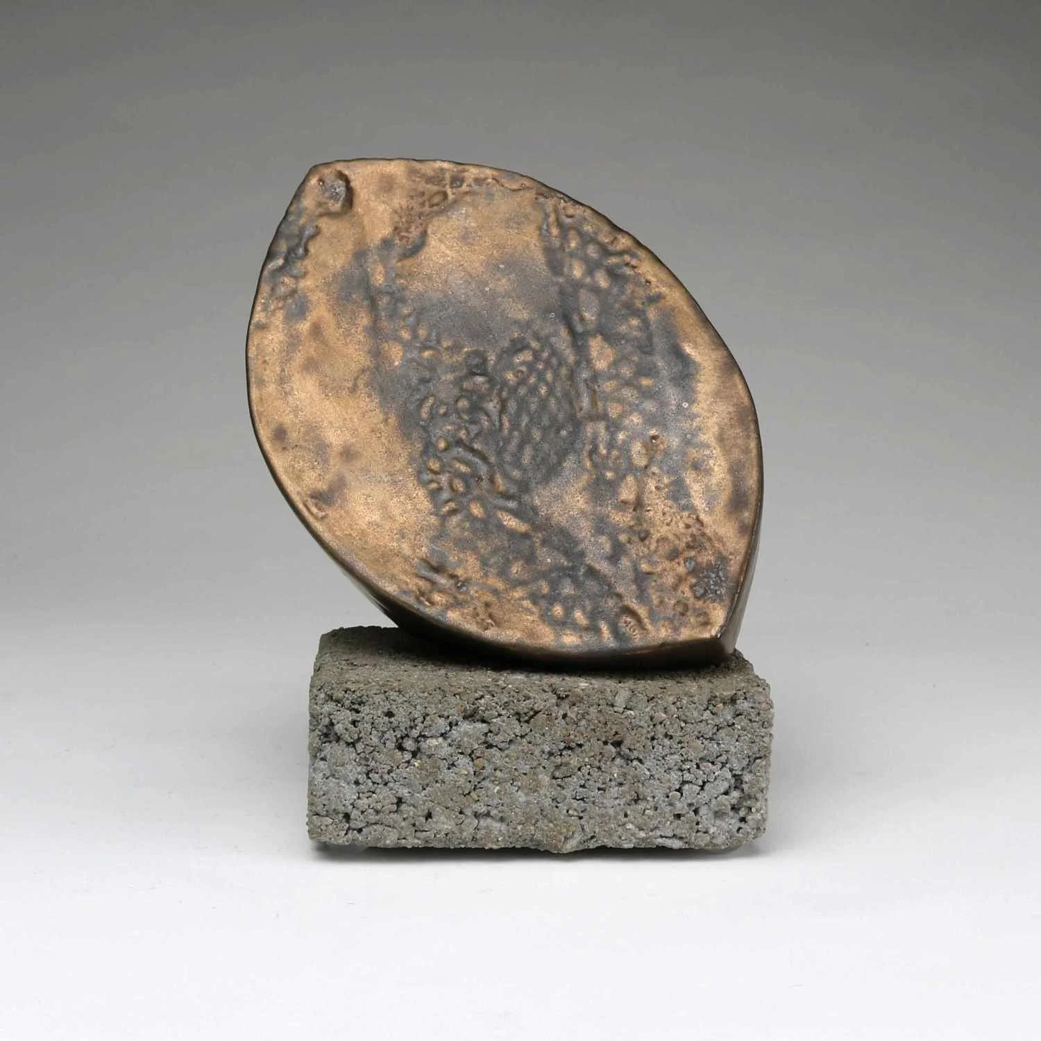 Abstract Ceramic Sculpture of two curved forms in bronze glaze