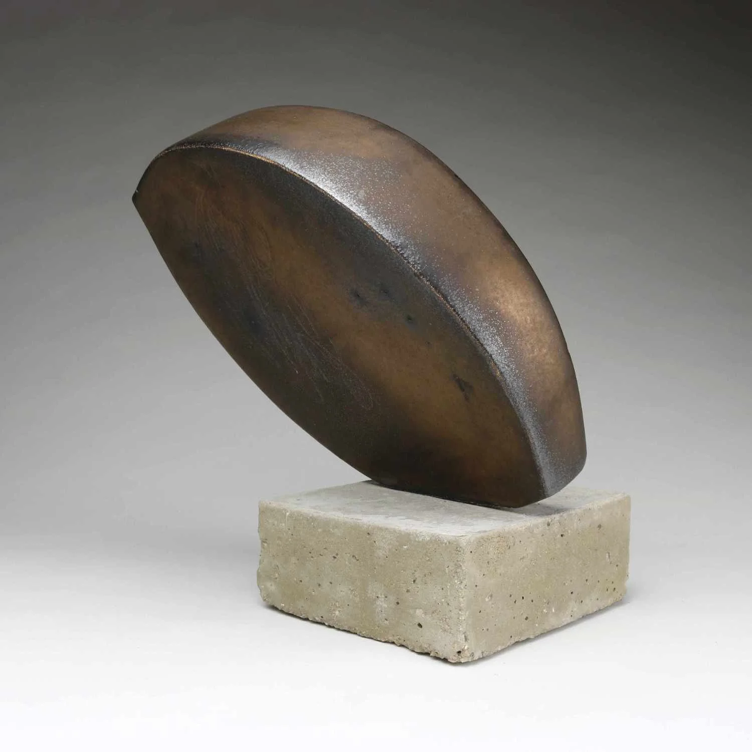 Abstract Ceramic Sculpture of two curved forms in bronze glaze