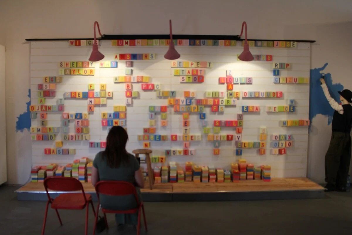 Laura Phelps Rogers in front of 1100 PIECES 2013.JPG