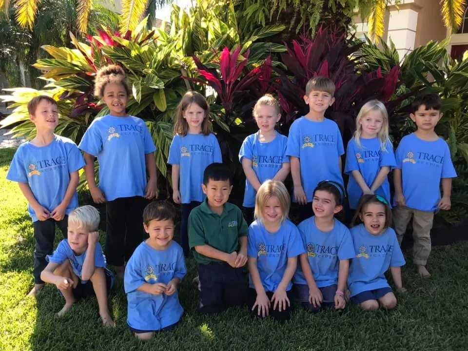 Elementary students smiling in a group on a field trip.jpg