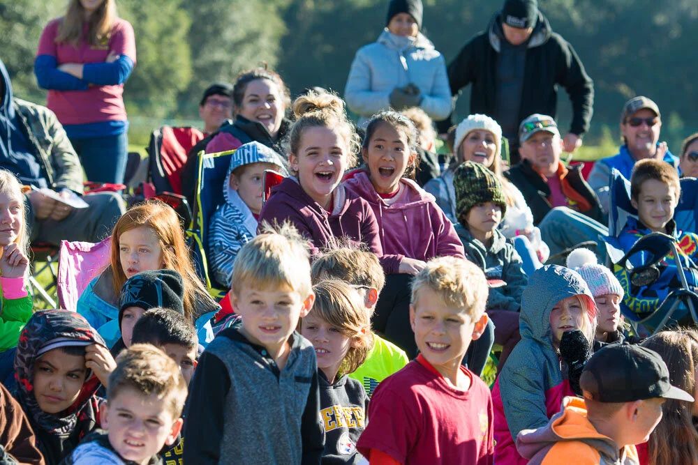 Families at a school event laughing
