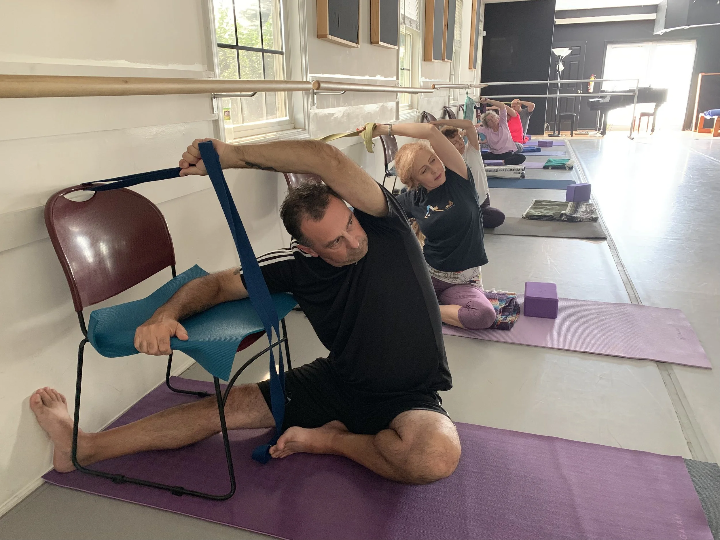 Mike and Christine chair yoga.jpeg