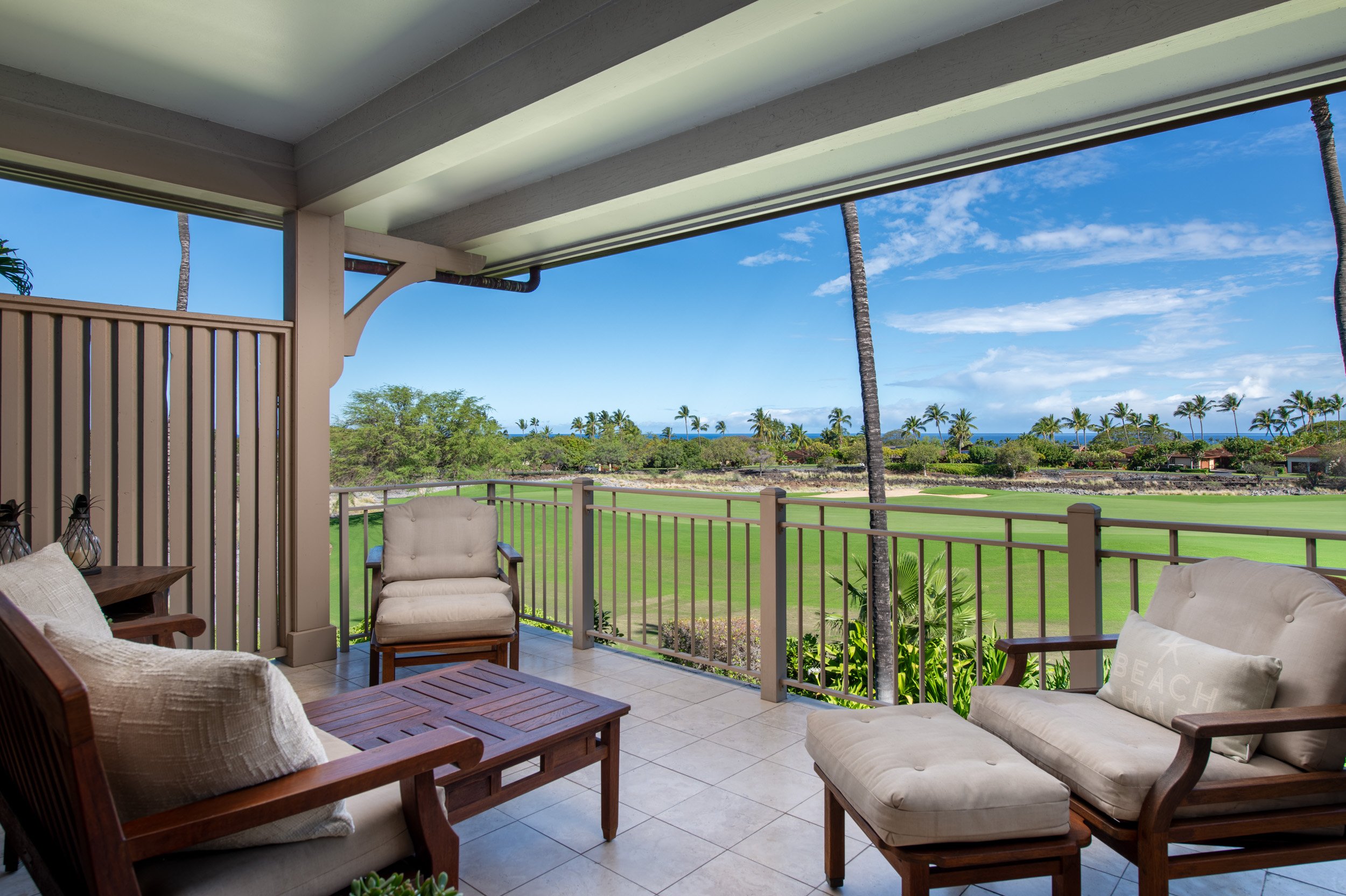 An expanded private lanai off the great room provides views of the golf course, ocean, and Maui.

