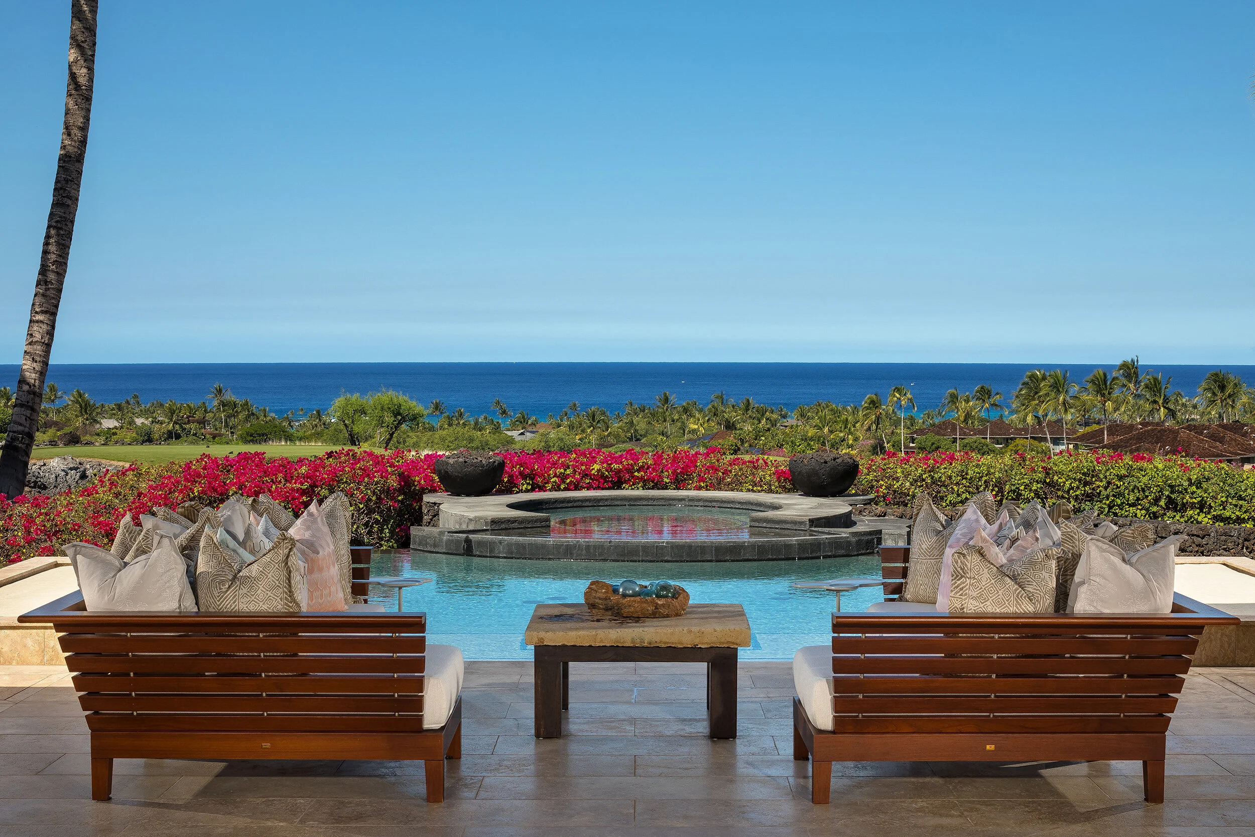 Relax out on the pool deck surrounded by expansive views down the Ke‘olu Golf Course.
