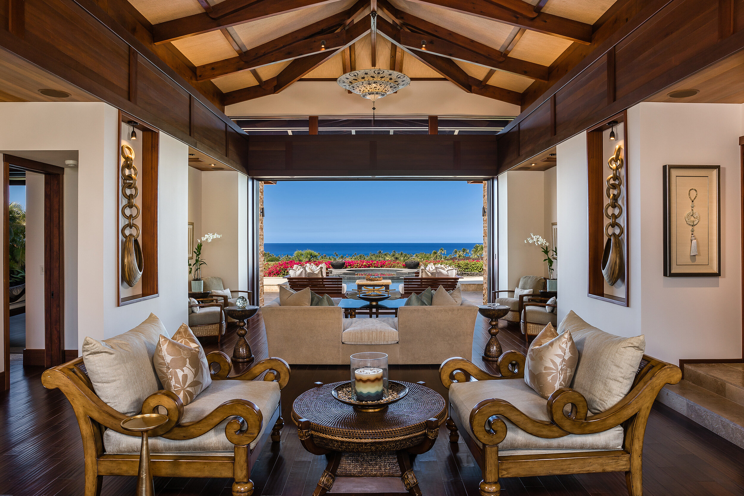 Centered within the main entry, the great room frames the picturesque Pacific Ocean.