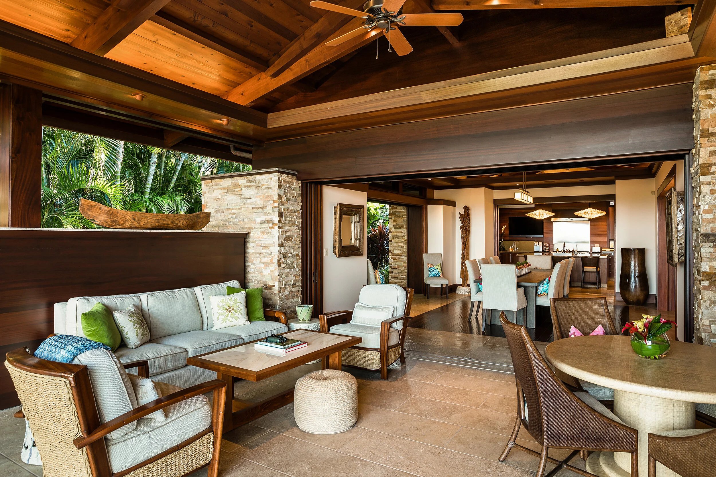 Covered dining room lānai provides secondary outdoor dining area.