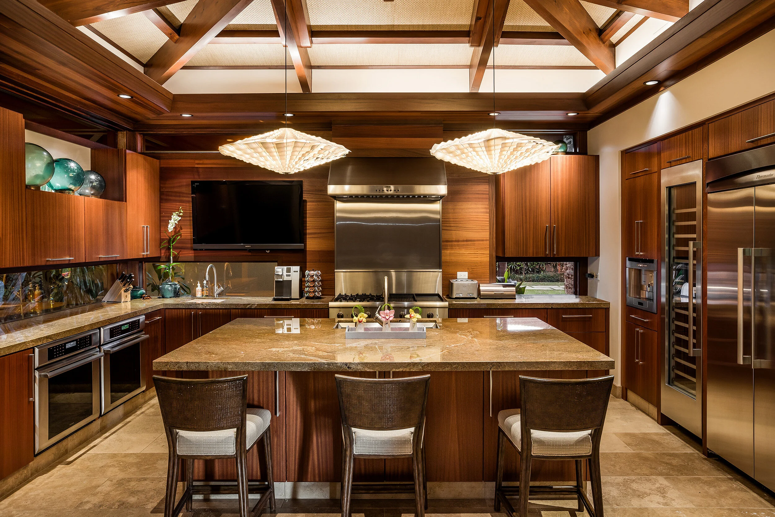Gourmet kitchen with granite countertops, custom cabinetry and Thermador professional appliances.