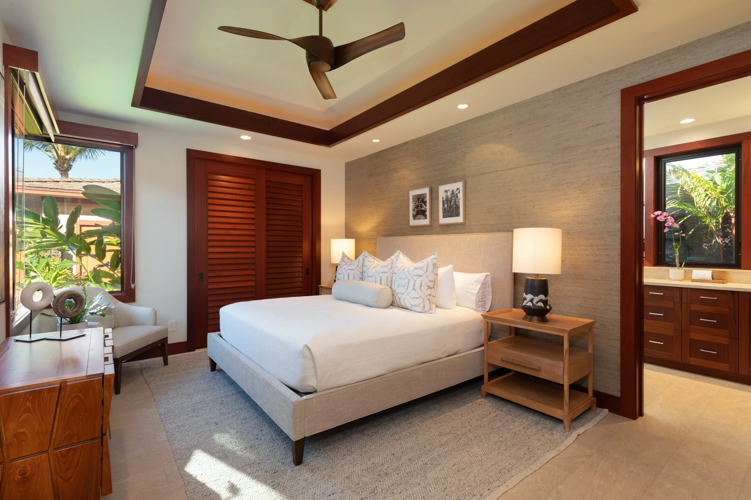 Second guest bedroom with courtyard view has ensuite bathroom with dual vanity, tiled shower and outdoor shower garden.
