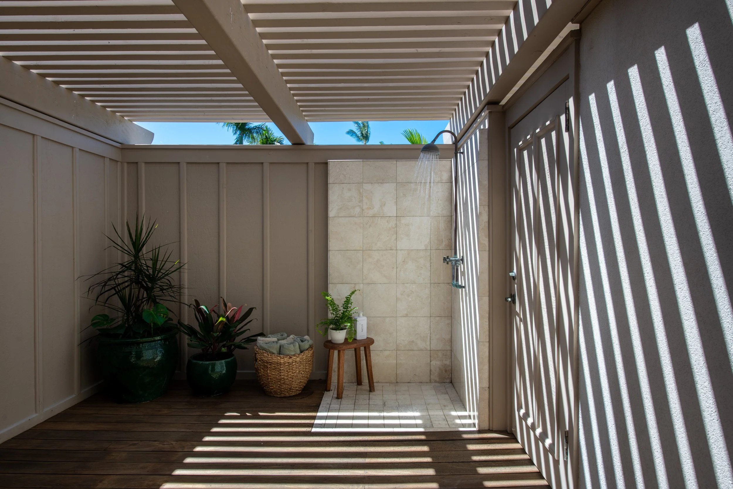 The outdoor shower provides a refreshing and private addition to the villa’s living space.