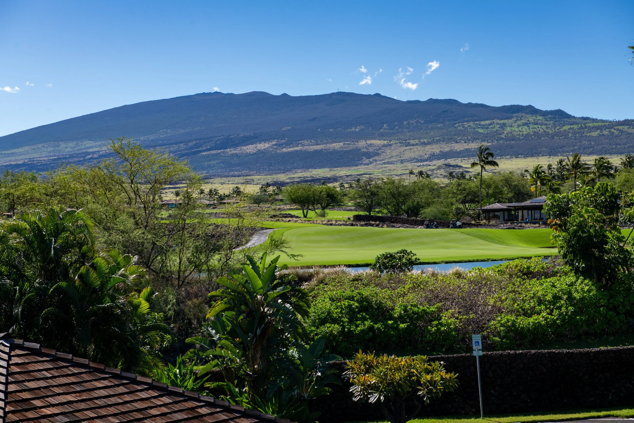 Hualalai Mountain views can be seen from the entry, the lanai off the kitchen, and the upstairs secondary bedroom.