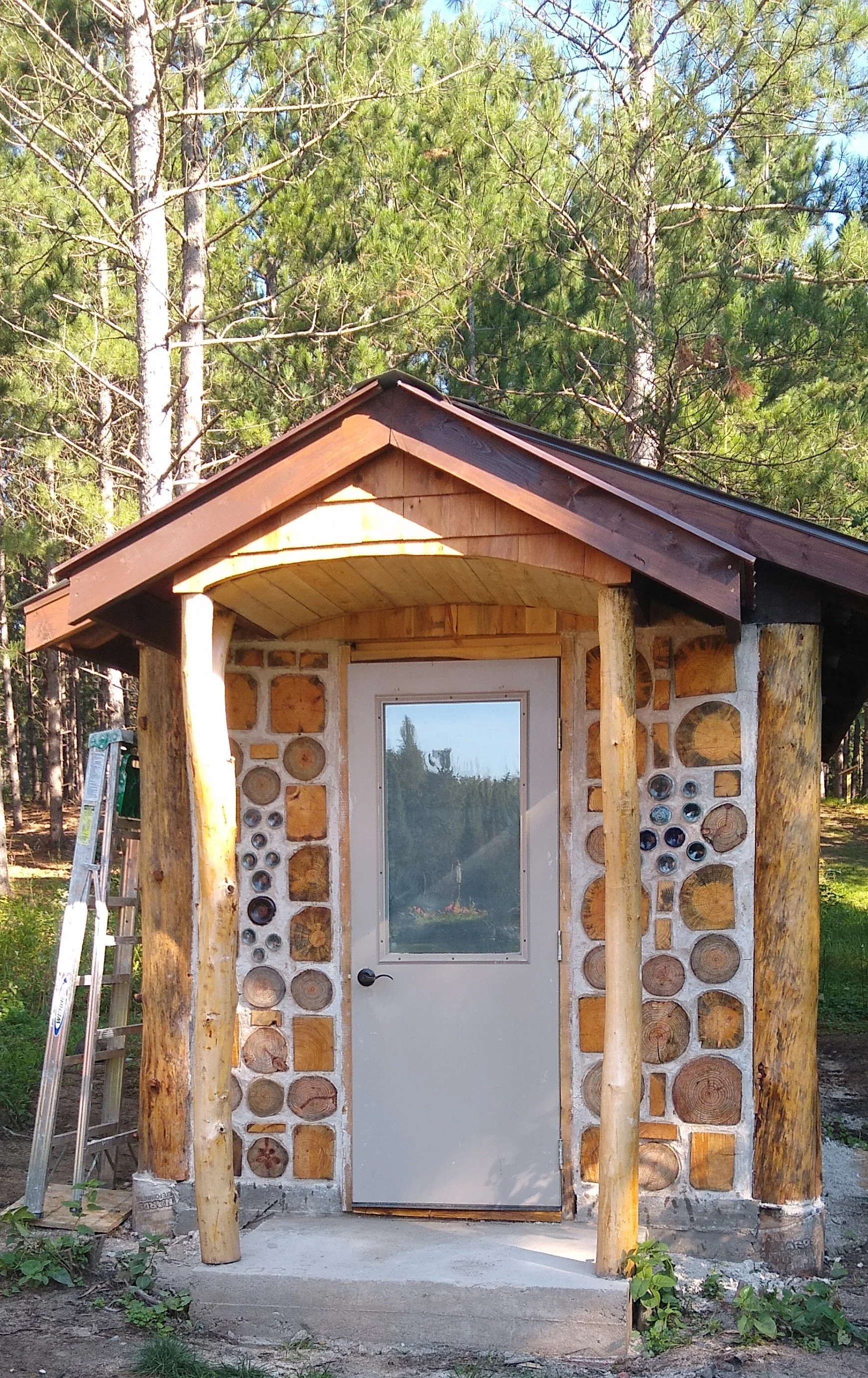 cordwood outhouse - front 2022.jpg