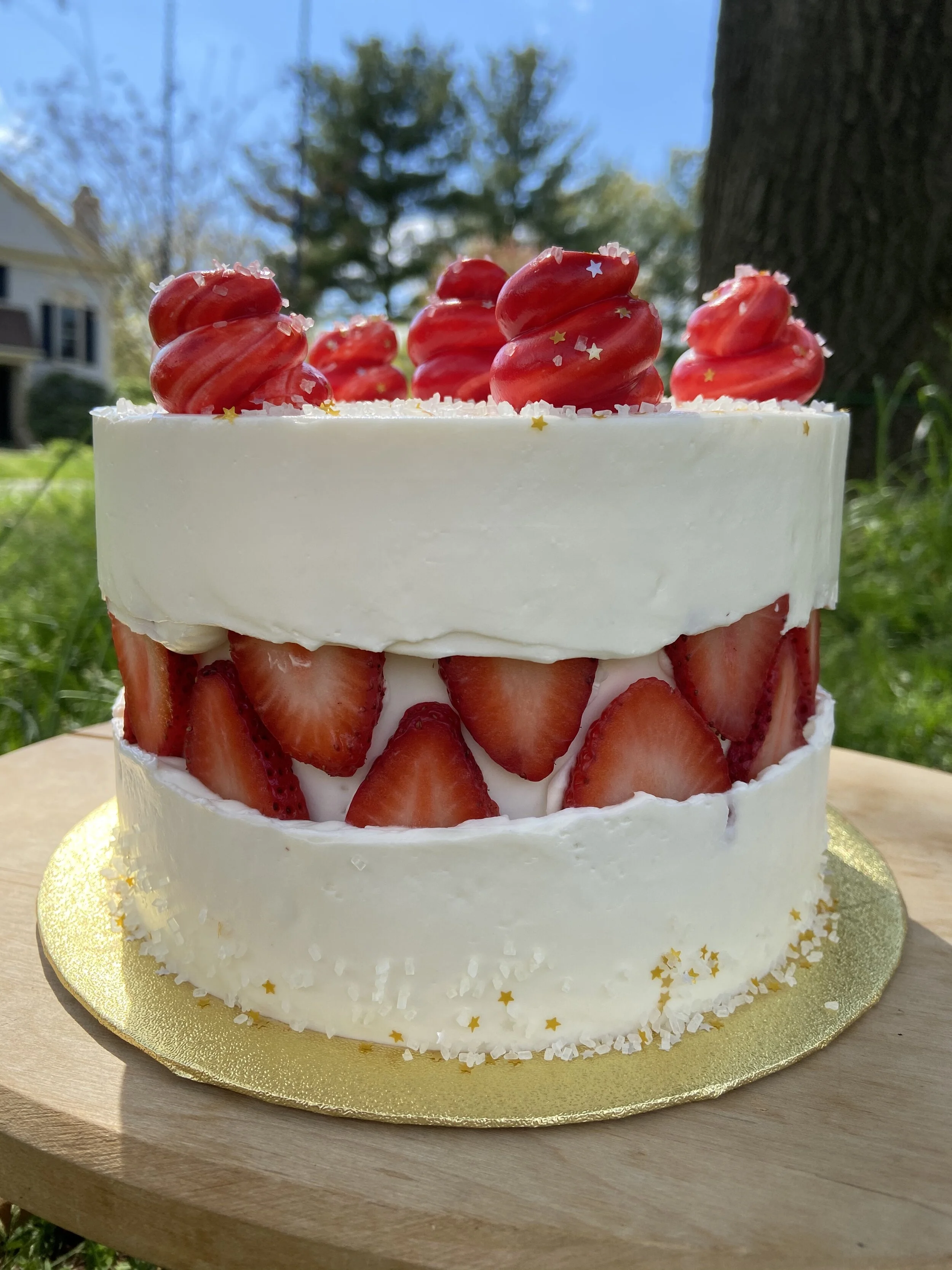 Strawberry shortcake cake with vanilla cake, vanilla syrup, whipped cream filling and fresh strawberries. 
