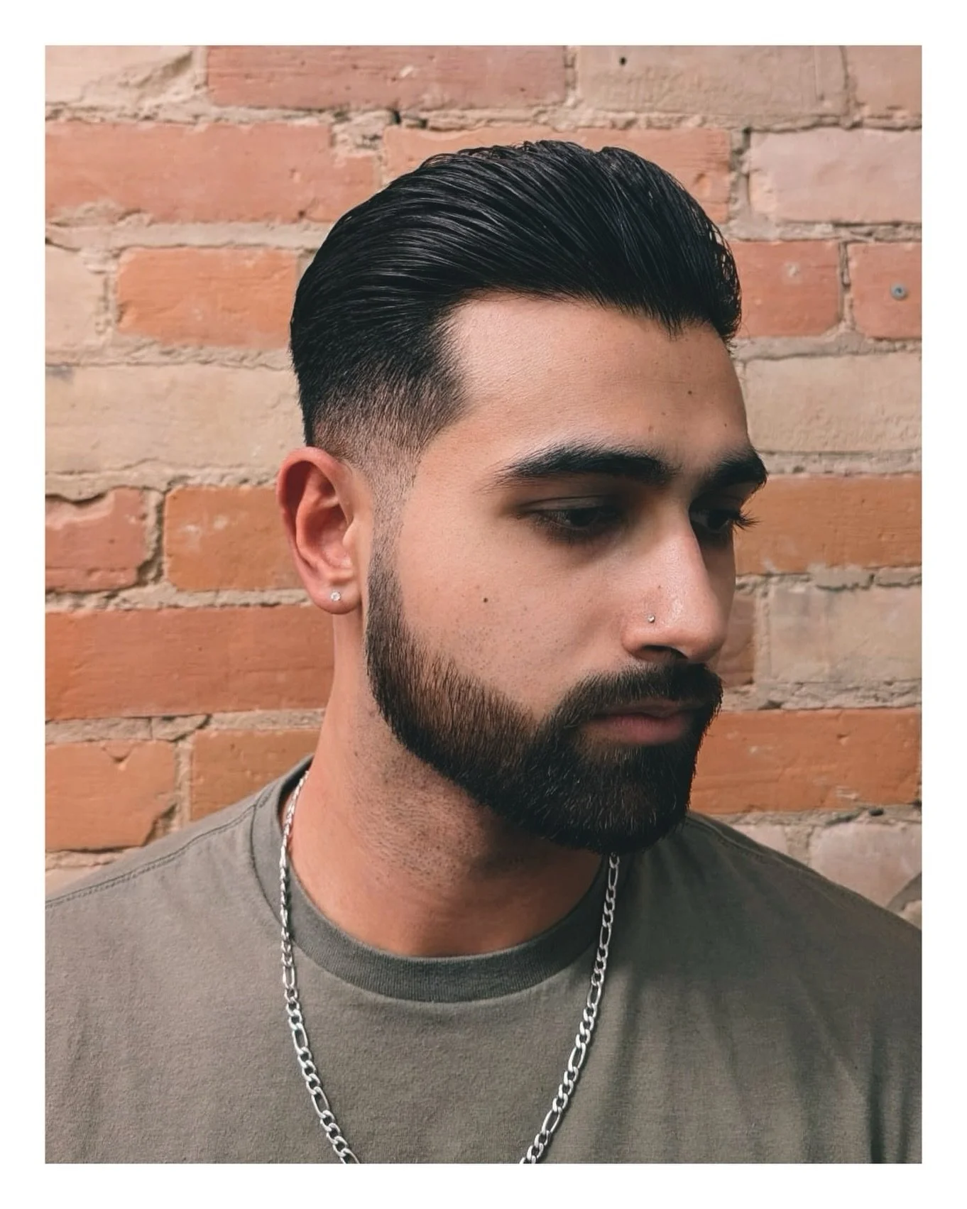 A clean slickback isn&rsquo;t just a haircut&mdash;it&rsquo;s a statement. The mid fade gives this look its sharpness while the slick top stays polished and controlled.

With the right product, it holds all day with minimal effort.

Book your next ap