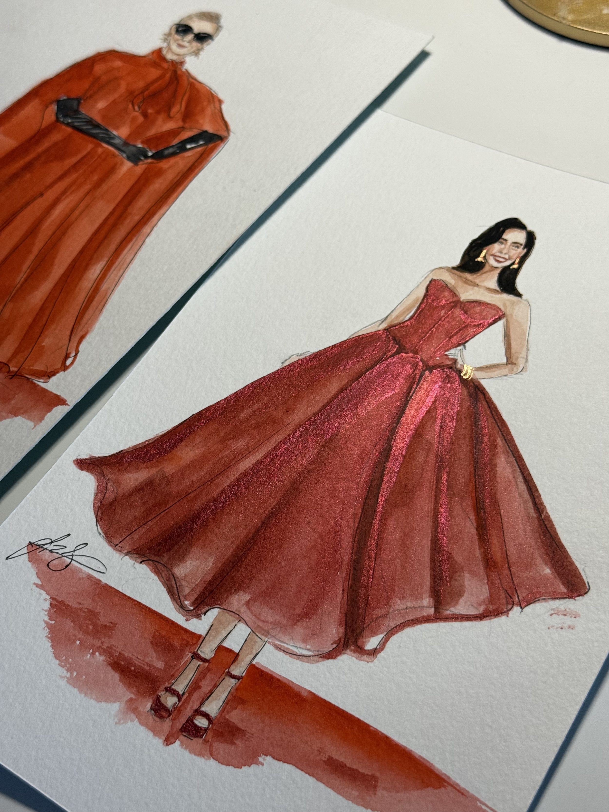 Fashion illustration of two women in red evening gowns, one with sunglasses and the other with earrings, watercolor style.
