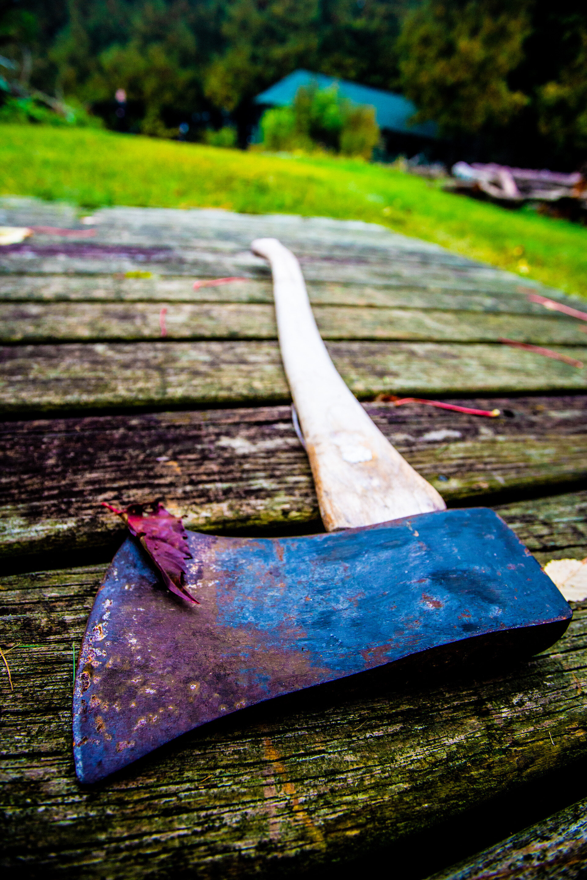 weathered axe on wood planks