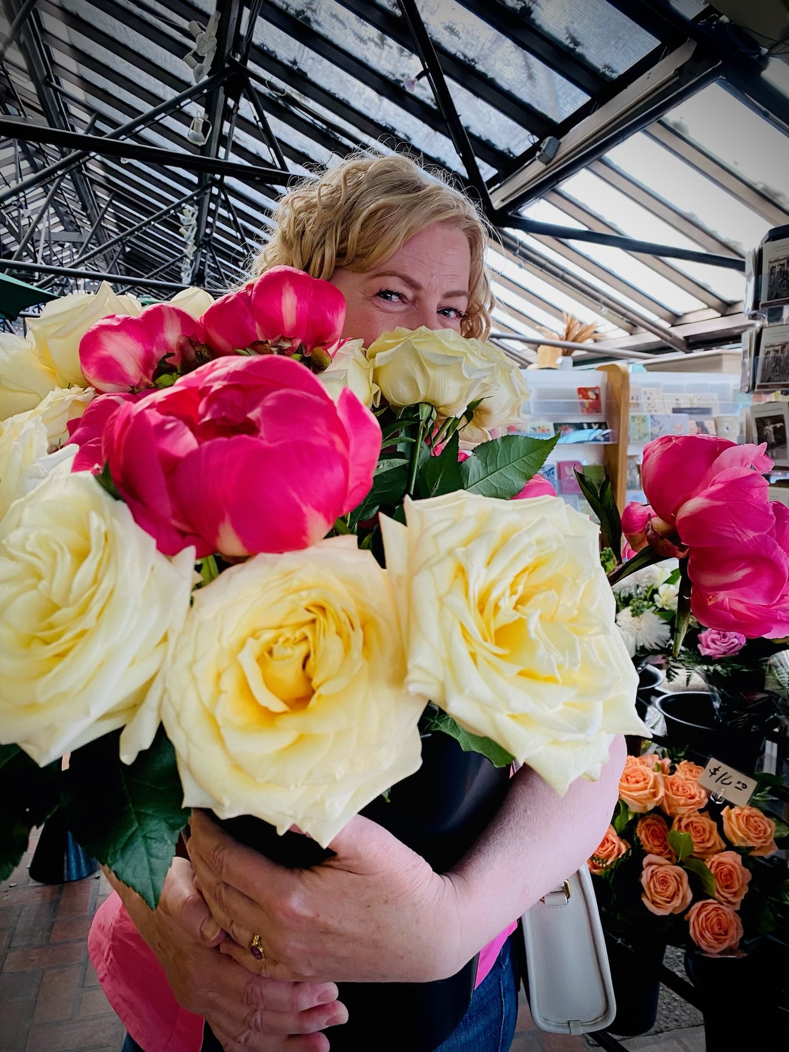 Anne with roses in store.jpg