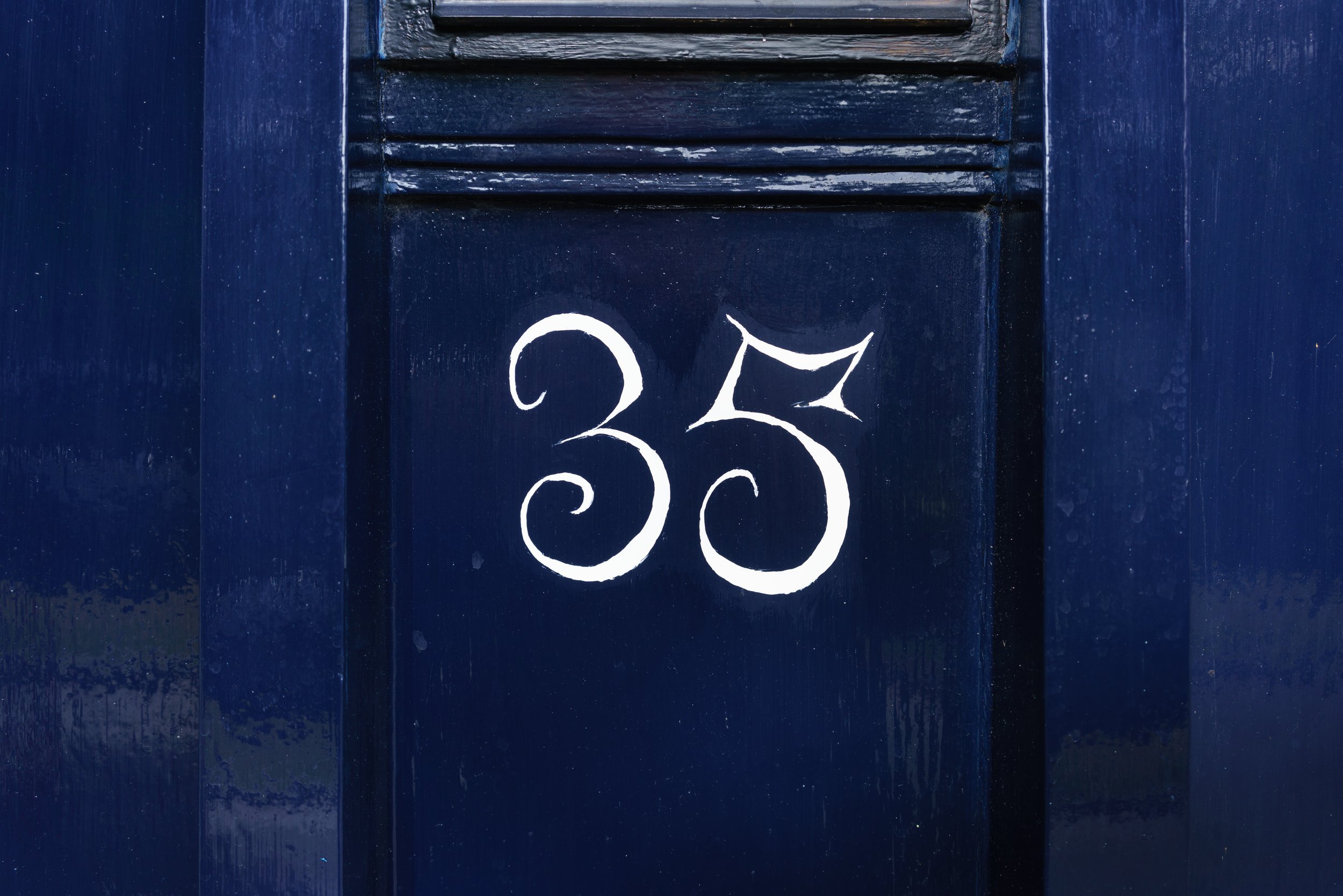 iStock house number 35 navy door_586929936.jpeg