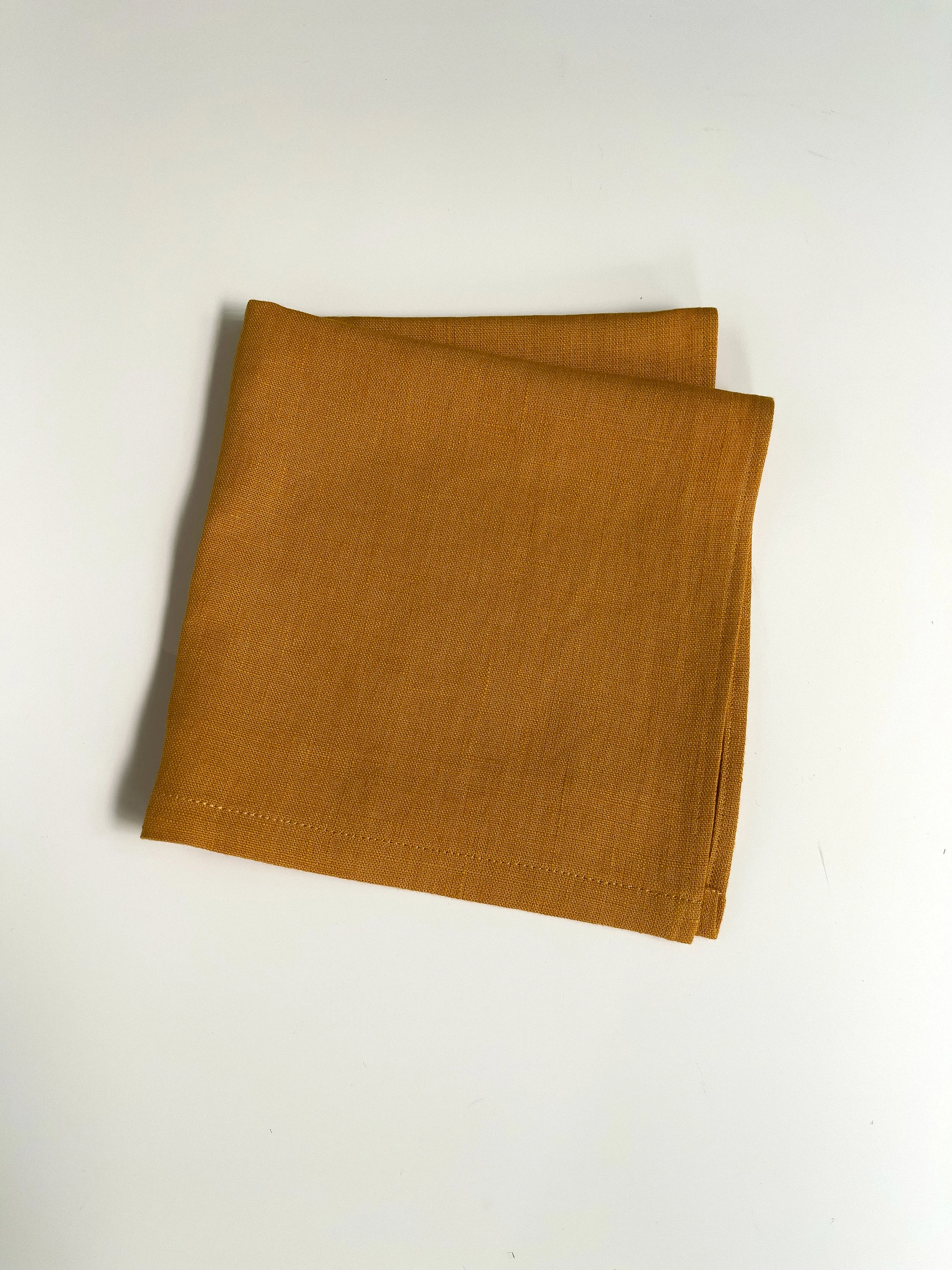 PRIDE NAPKINS_Saffron_tabletop white bkgd.jpg