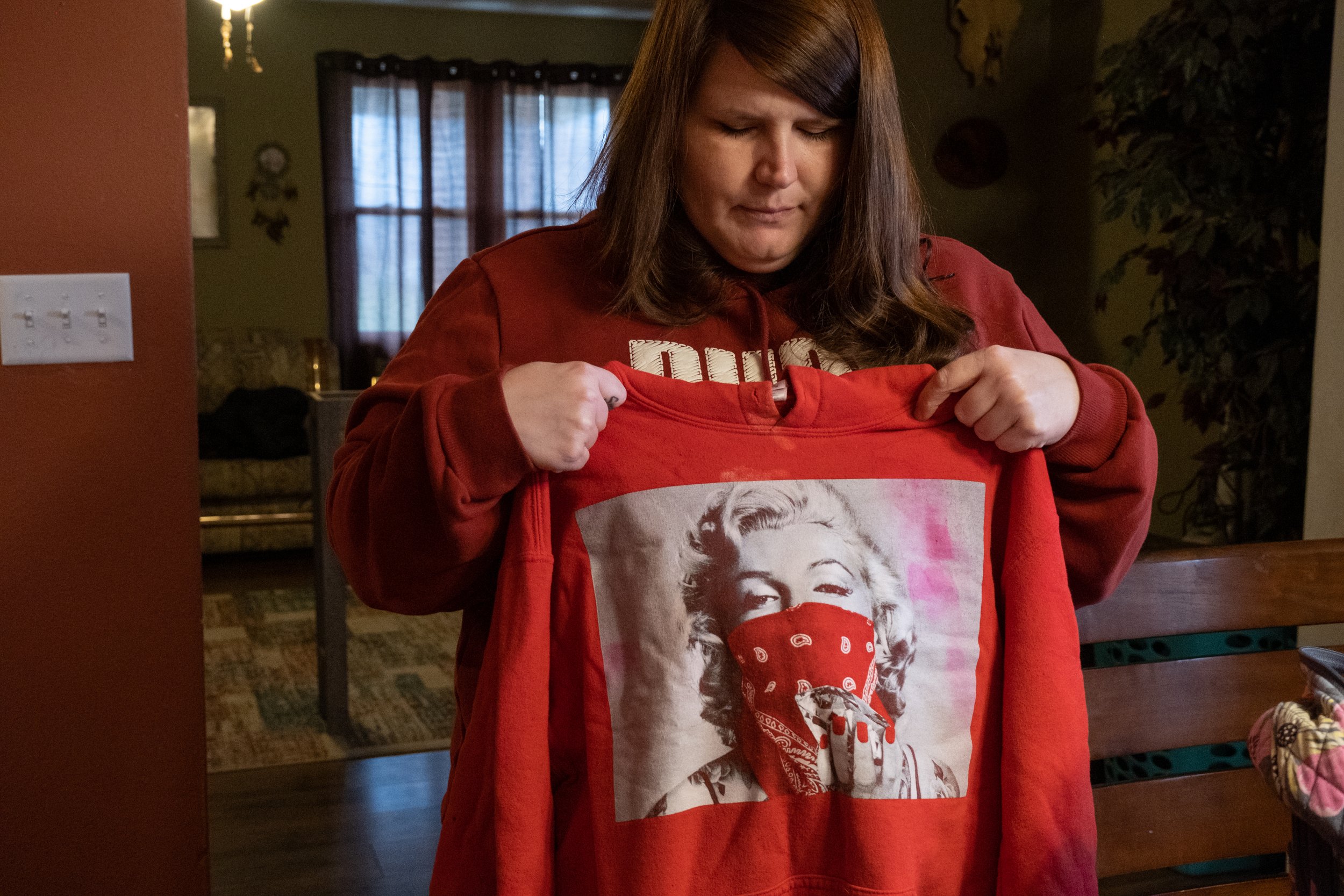  On April 2, 2022, Justice holds the sweatshirt Rodgers was wearing the night of her death. She keeps it in the overnight bag her daughter packed for the night she fatally overdosed in November 2020. The police returned the items to Justice. (Photo ©