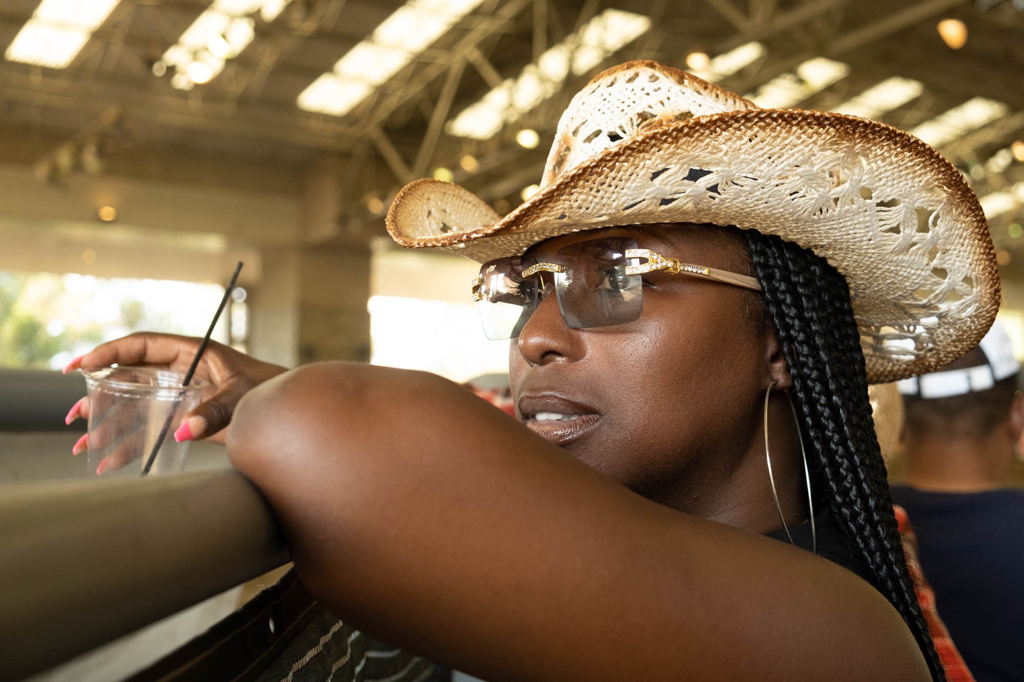  Shanita poses for a portrait at the Bill Pickett Rodeo on July 17, 2022. Her husband introduced her to the rodeo over 15 years ago and she’s attended every year since. In 2021 she lost her husband to COVID-19. She said it's difficult being at the ro