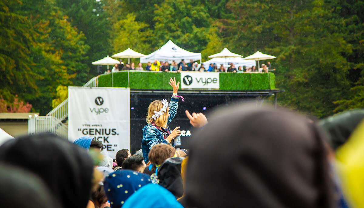 Festival goers enjoying the live music at Skookum Music Festival at Stanley Park in Vancouver, Canada