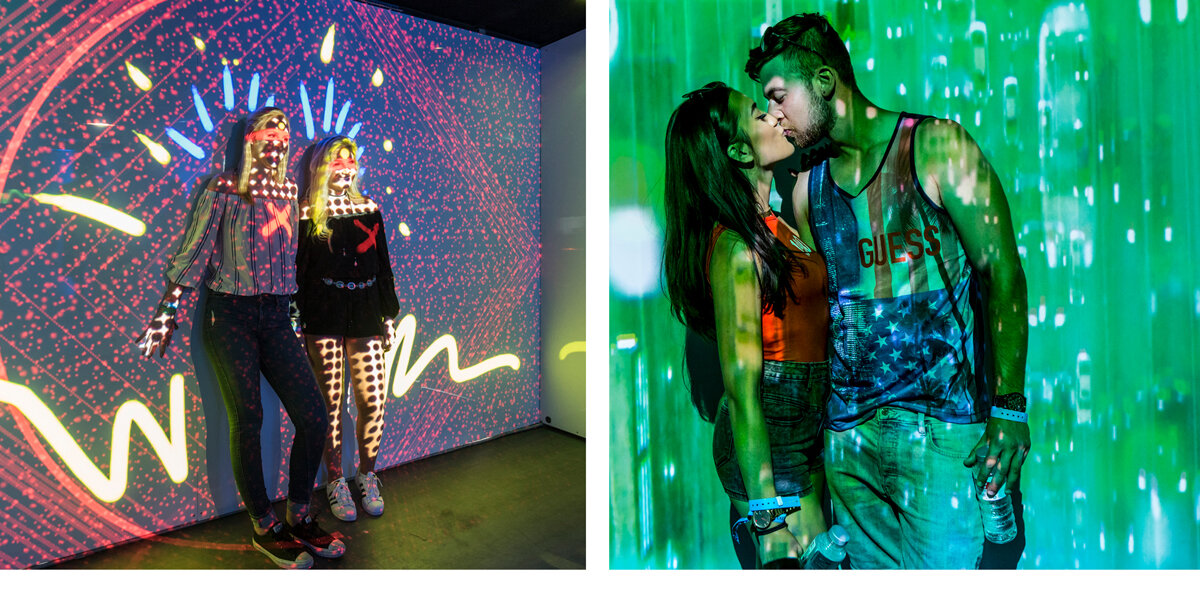 Couple kissing infront of interactive graffiti wall inside Blue Lounge brand activation