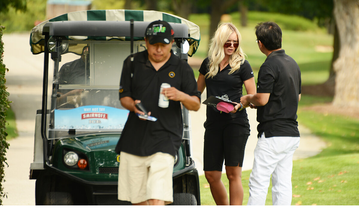 1 female golf Marshall assisting golfers on the course. 