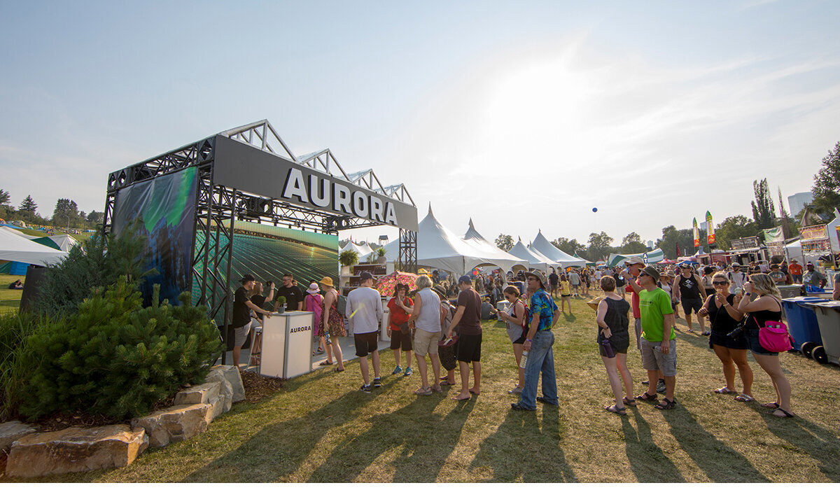 A long lineup of people waiting to chat with brand ambassadors at the Aurora Cannabis brand activation in Alberta, Canada