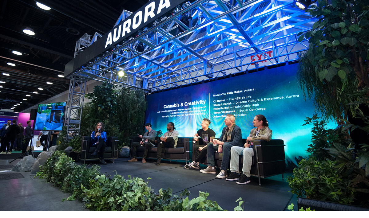 Panel of 5 presenters at the Vancouver Cannabis Convention chatting with the crowd at the Aurora brand activation