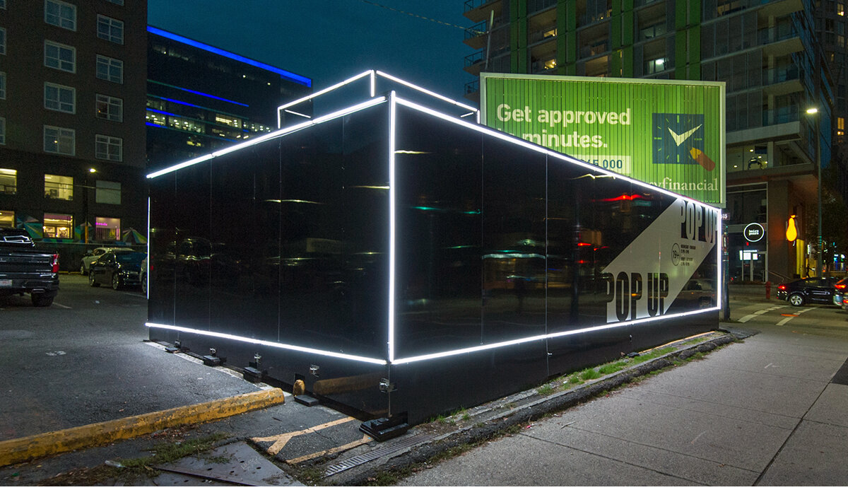 Exterior photo of the Vuse brand activation popup in Downtown Vancouver. Entire popup is illuminated with LED tubes.