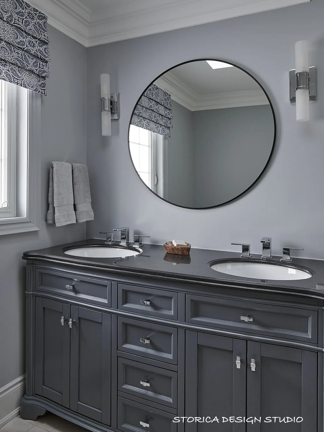 For this bathroom refresh, we kept the existing vanity but gave it a fresh, updated look with a new finish. We also added new lighting, a modern mirror, and custom window treatments to bring in softness and polish.  Sometimes, it&rsquo;s not about st