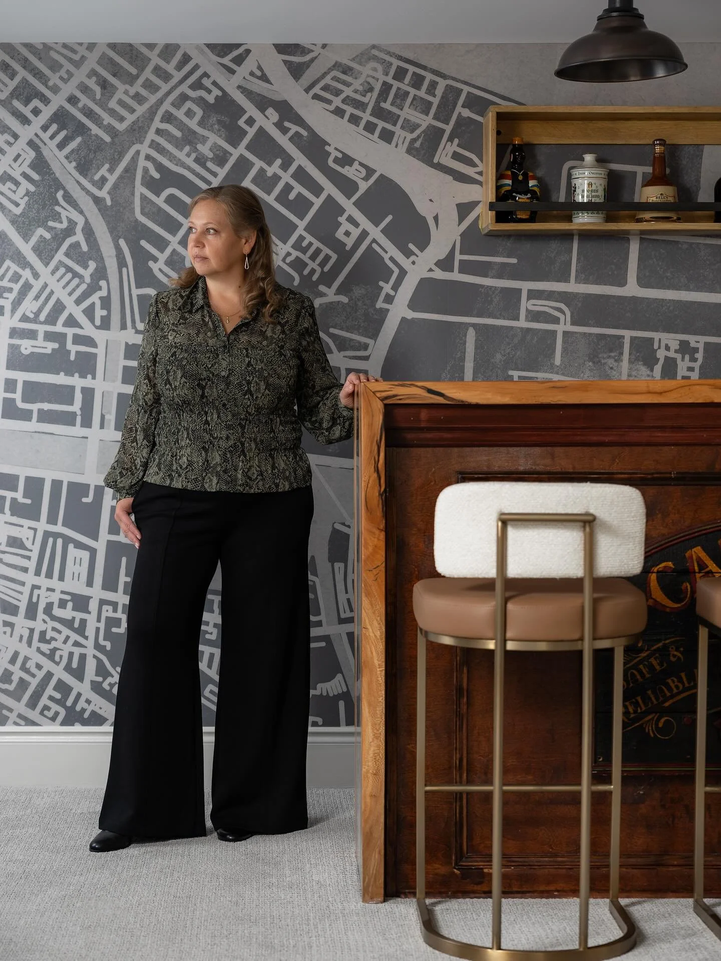 I am very proud of how this bar area turned out and love when designs just come together in the most meaningful way.
The Dublin map wallpaper and custom bar top add character and dimension but the little barman statue which I came across in the clien