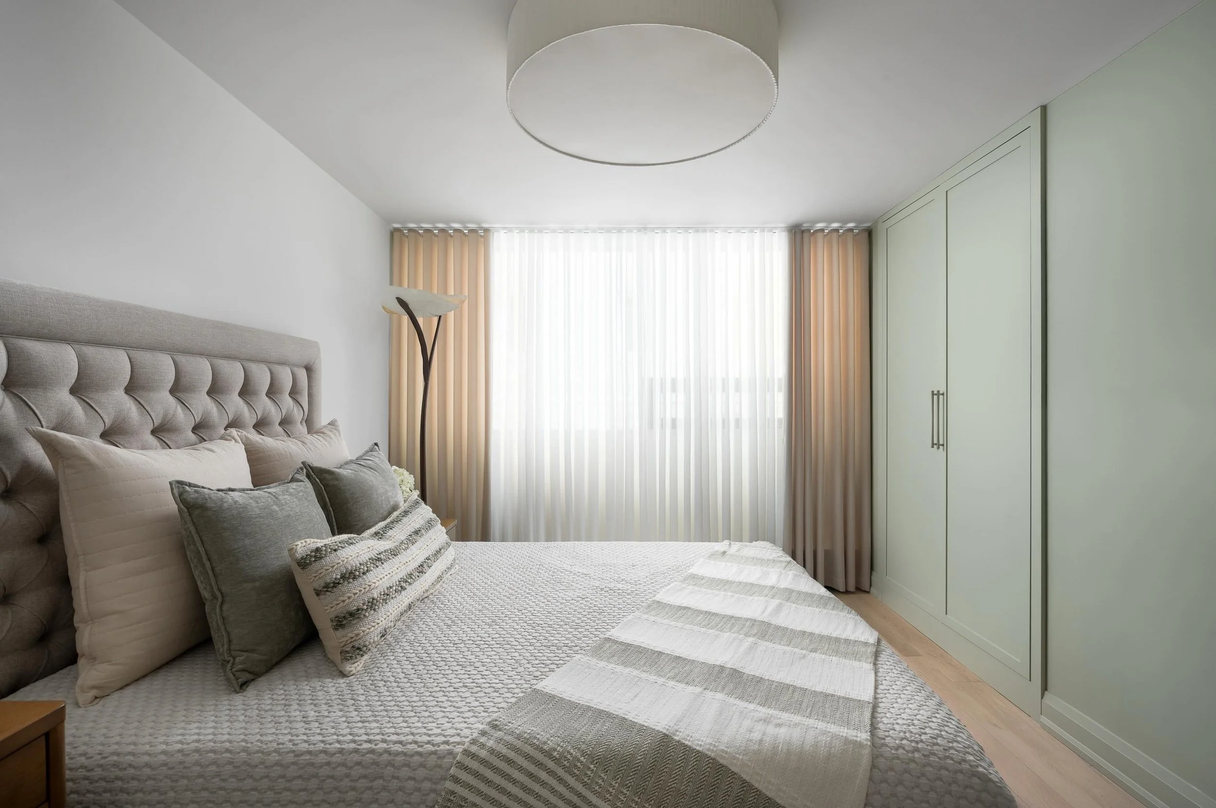 If you are investing in your home, every room should feel considered.

This guest bedroom was designed with the same level of attention as the primary suite, custom drapery for controlled light and an upholstered bed that brings comfort to the space.