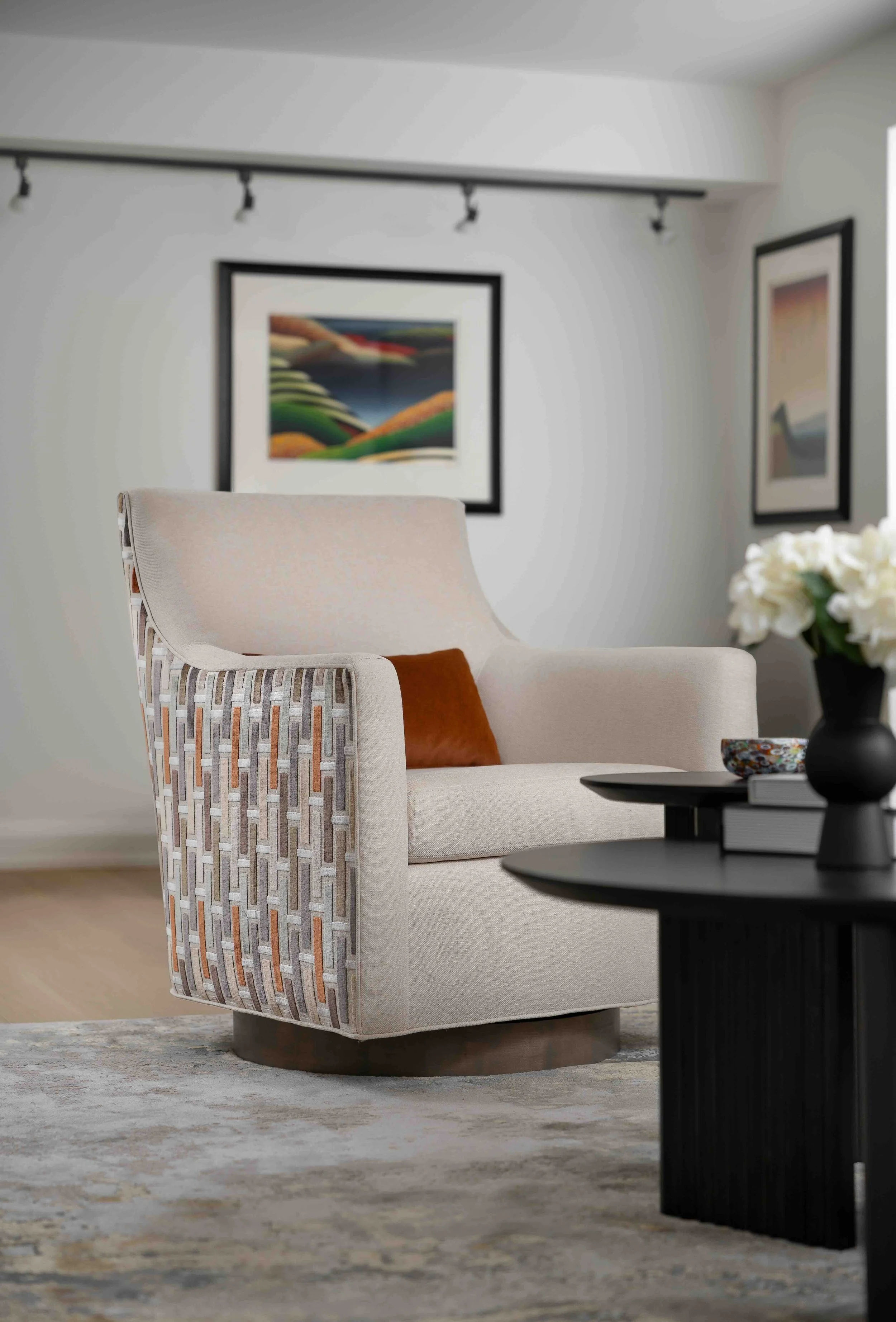 Modern condo living room with upholstered accent chair and contemporary styling.
