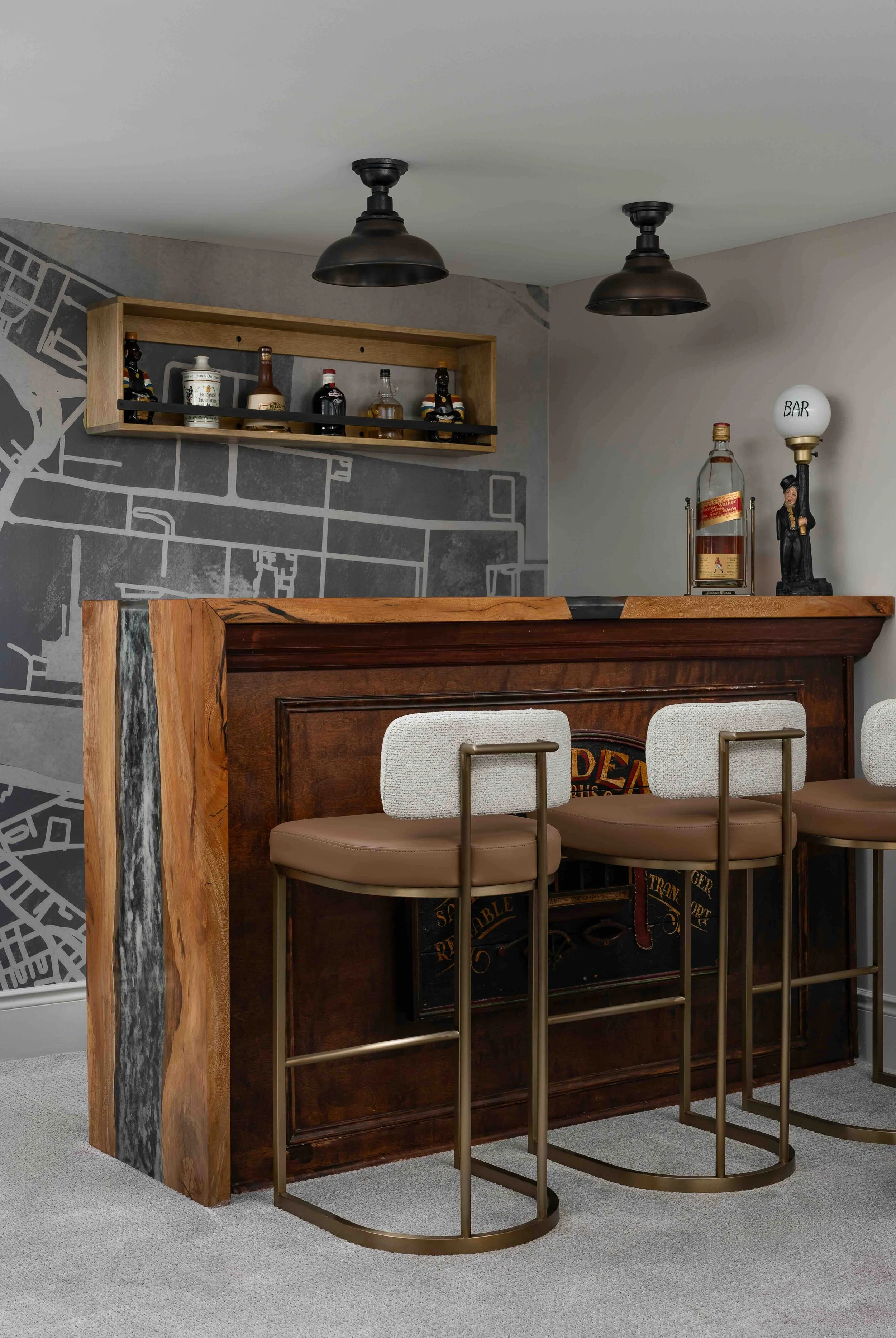 Custom basement bar with live edge wood counter, epoxy resin detail, and modern bar seating in a King City home renovation.