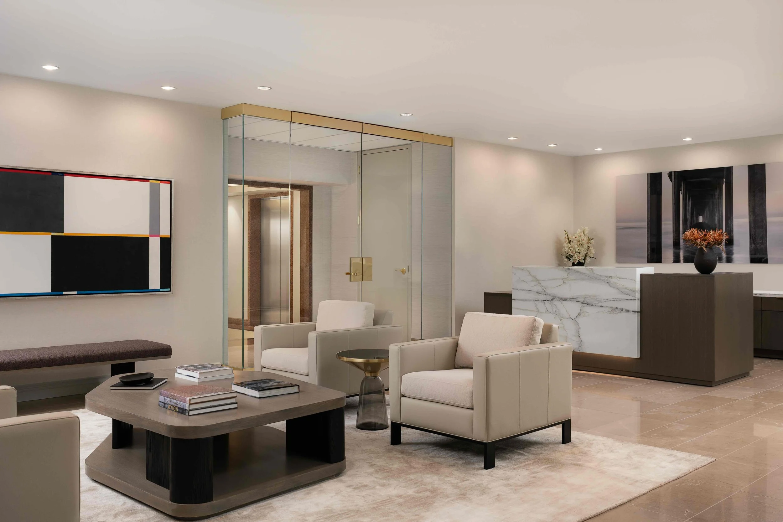 Modern office lobby interior with reception desk, lounge seating, and contemporary corporate design.