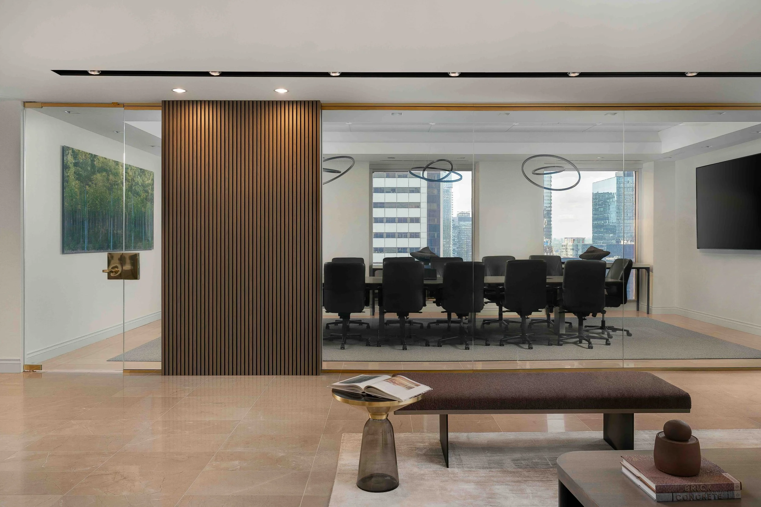 Modern office boardroom with smart glass, wood slat feature panel, and contemporary corporate interior design in Toronto.