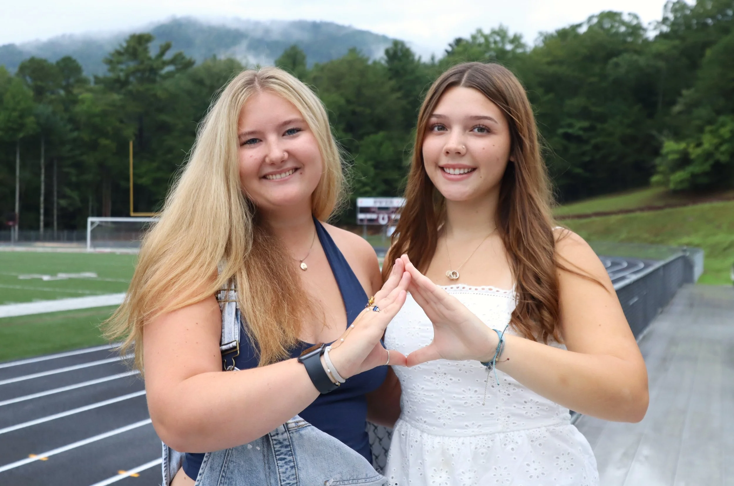 Madeleine Pomeroy (DECA) and Ella Edens (Interact Club)