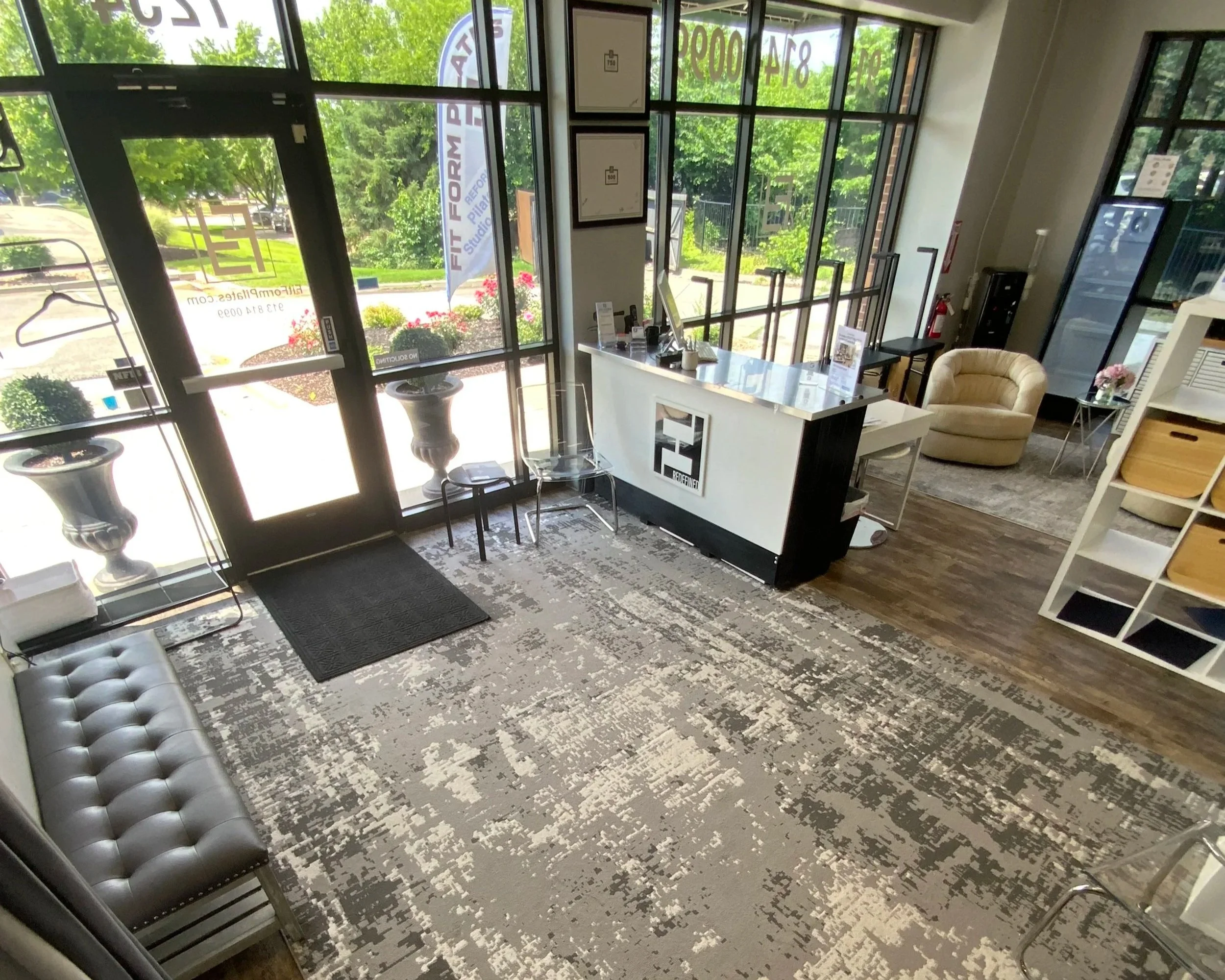 Bright and clean front desk and entry way at Fit Form Pilates in Overland Park, Kansas.