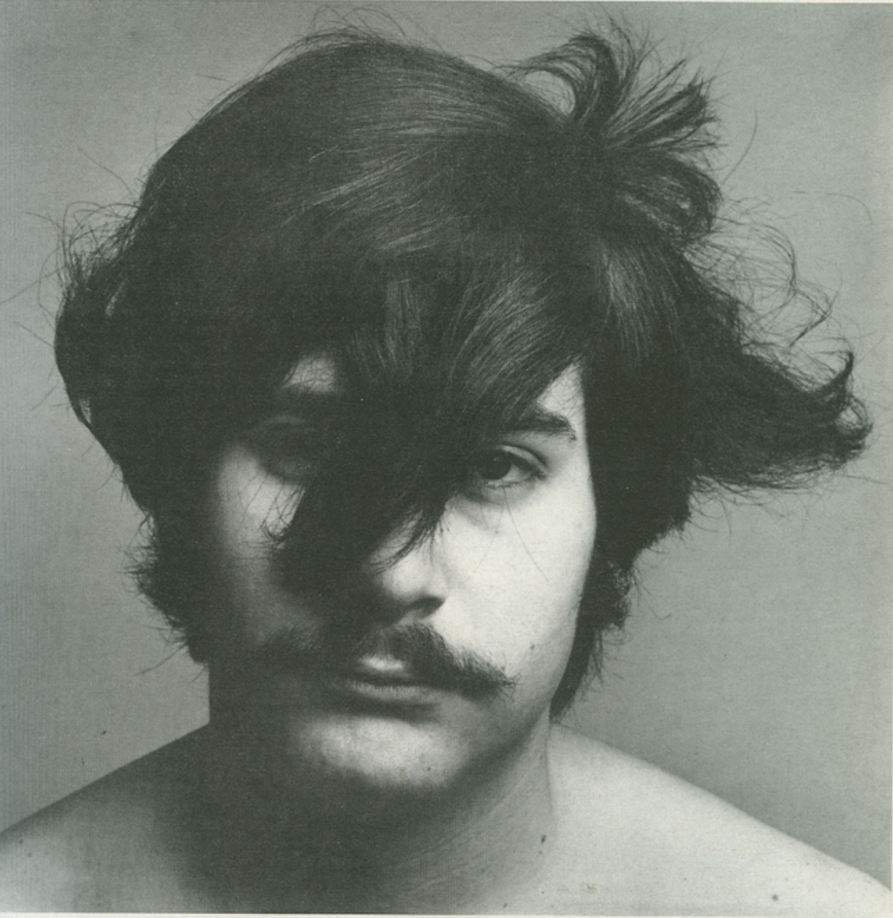 1970s men's wavy hair with fringe