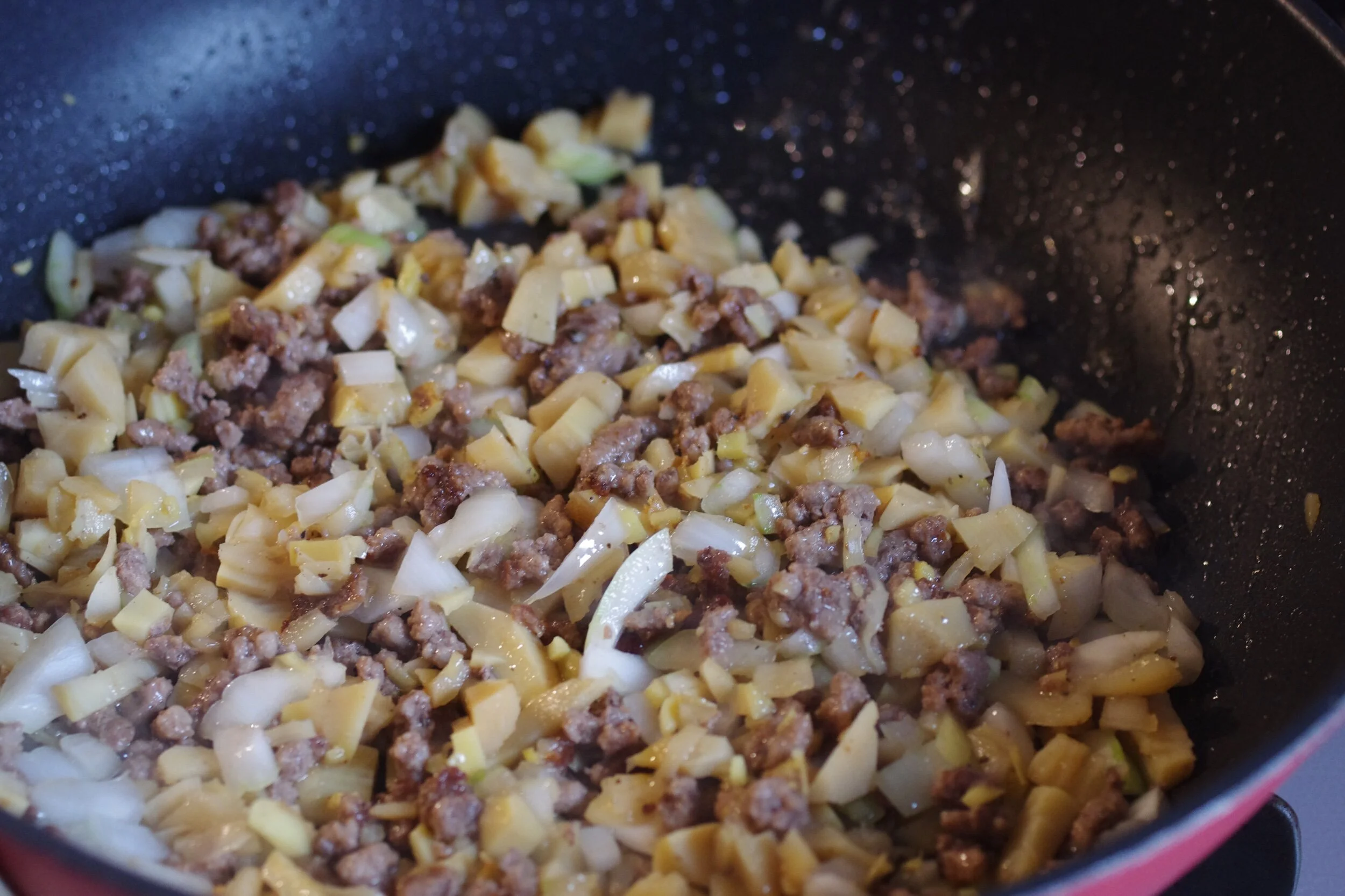 Directions&nbsp;Diced fresh or caned bamboo to small and white onionIn the frypan, with medium meat, add rice oil, and minced pork for a few minutes with chopped garlic and gingerBrown the pork. When the meat becomes brown and crispy, add chopped onions and diced bamboo shoots&nbsp;Add 2 cups cooked Japanese rice and mix well