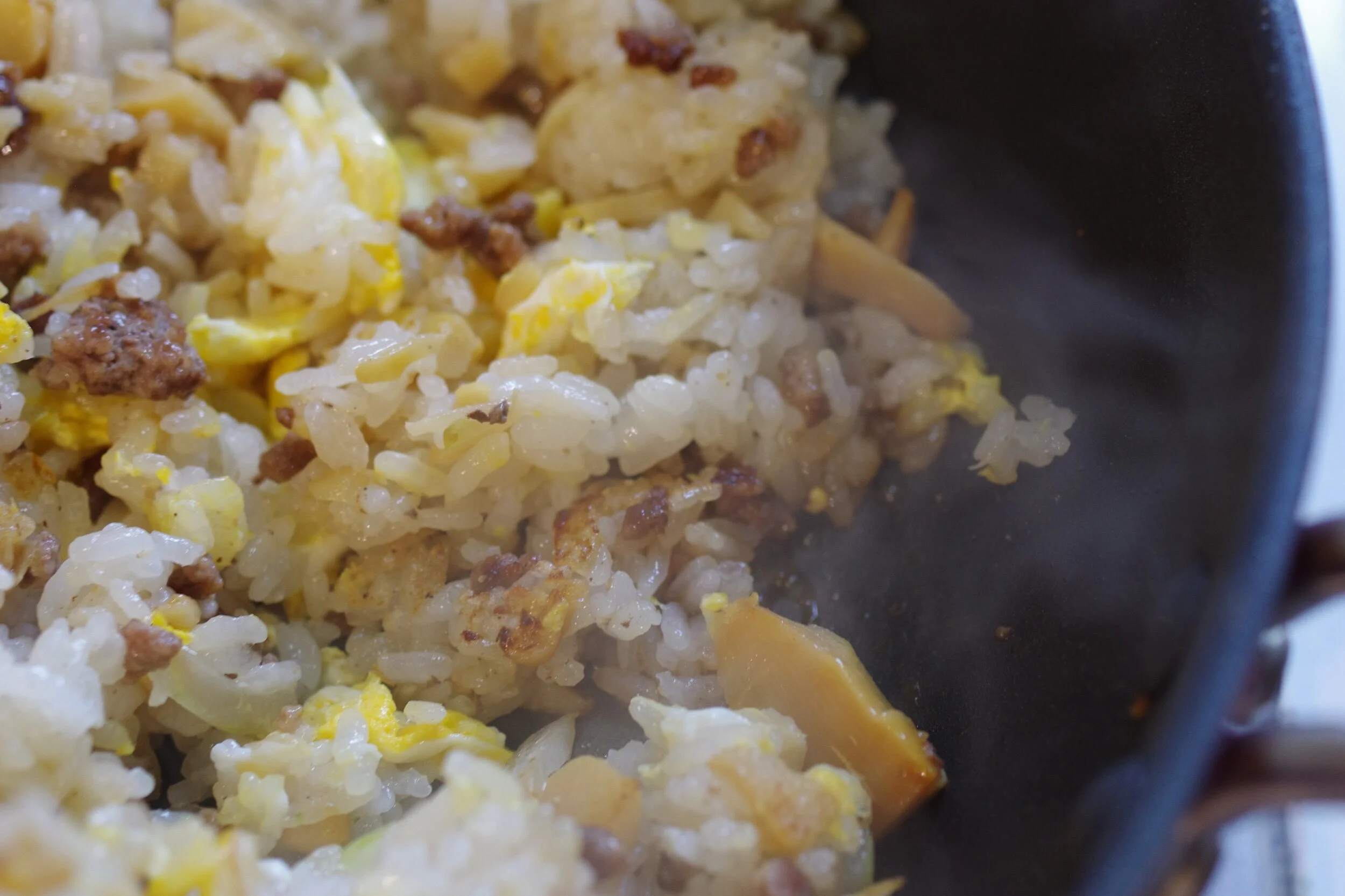 Mix the egg and rice well and add the soy sauce from the edge of the frypan.Add&nbsp;&nbsp;sesame oil lastly and serve.Serve on the plate with ginger pickle and sprinkle with green peas (optional)