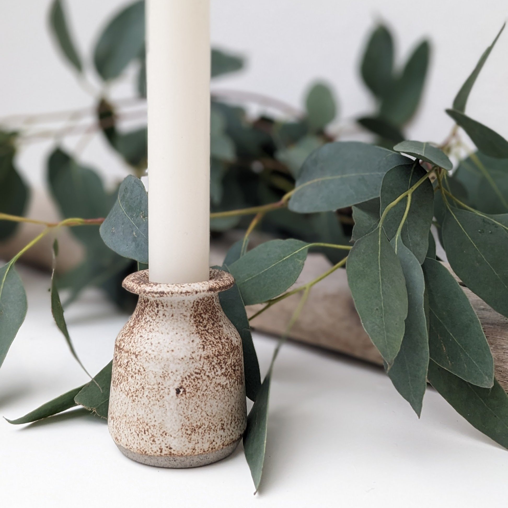 Speckled candlestick holder