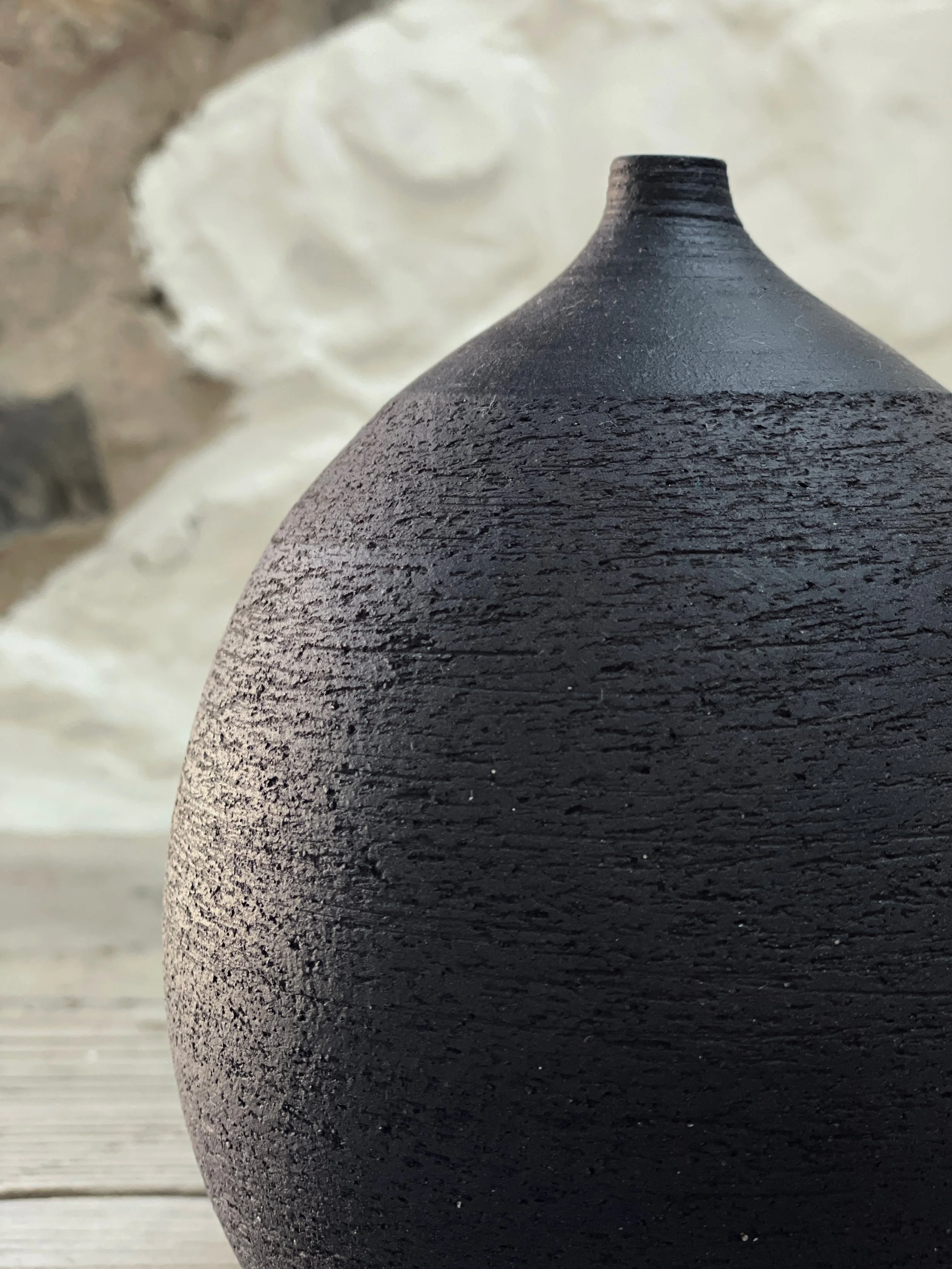Textured black bottle 2.JPG