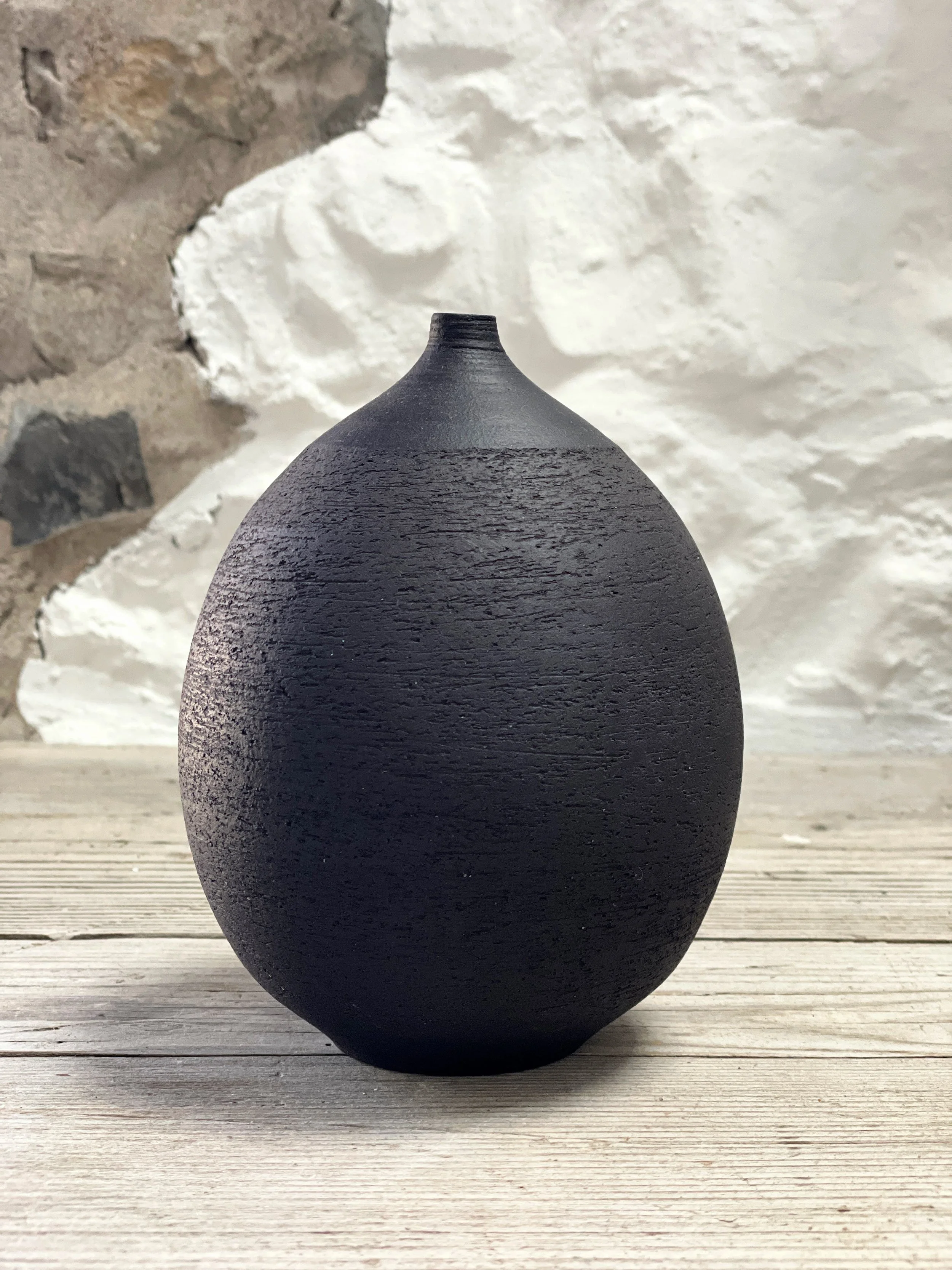 Textured black bottle.JPG